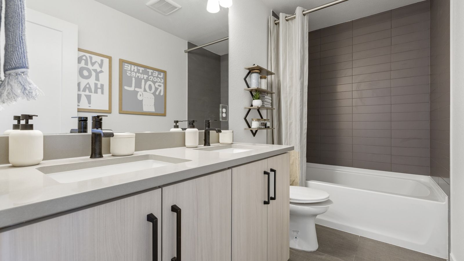 Experience luxury design in this residential home's modern bathroom architecture and style.