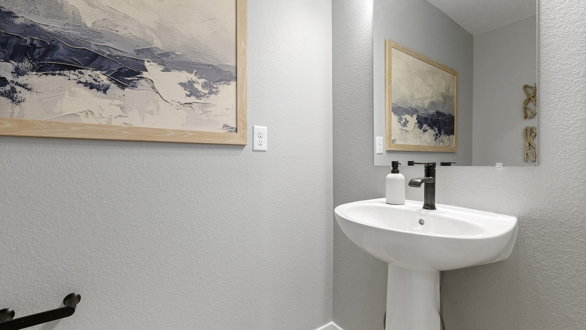 Experience luxury with minimalist architecture in this elegantly designed single-family home washroom.