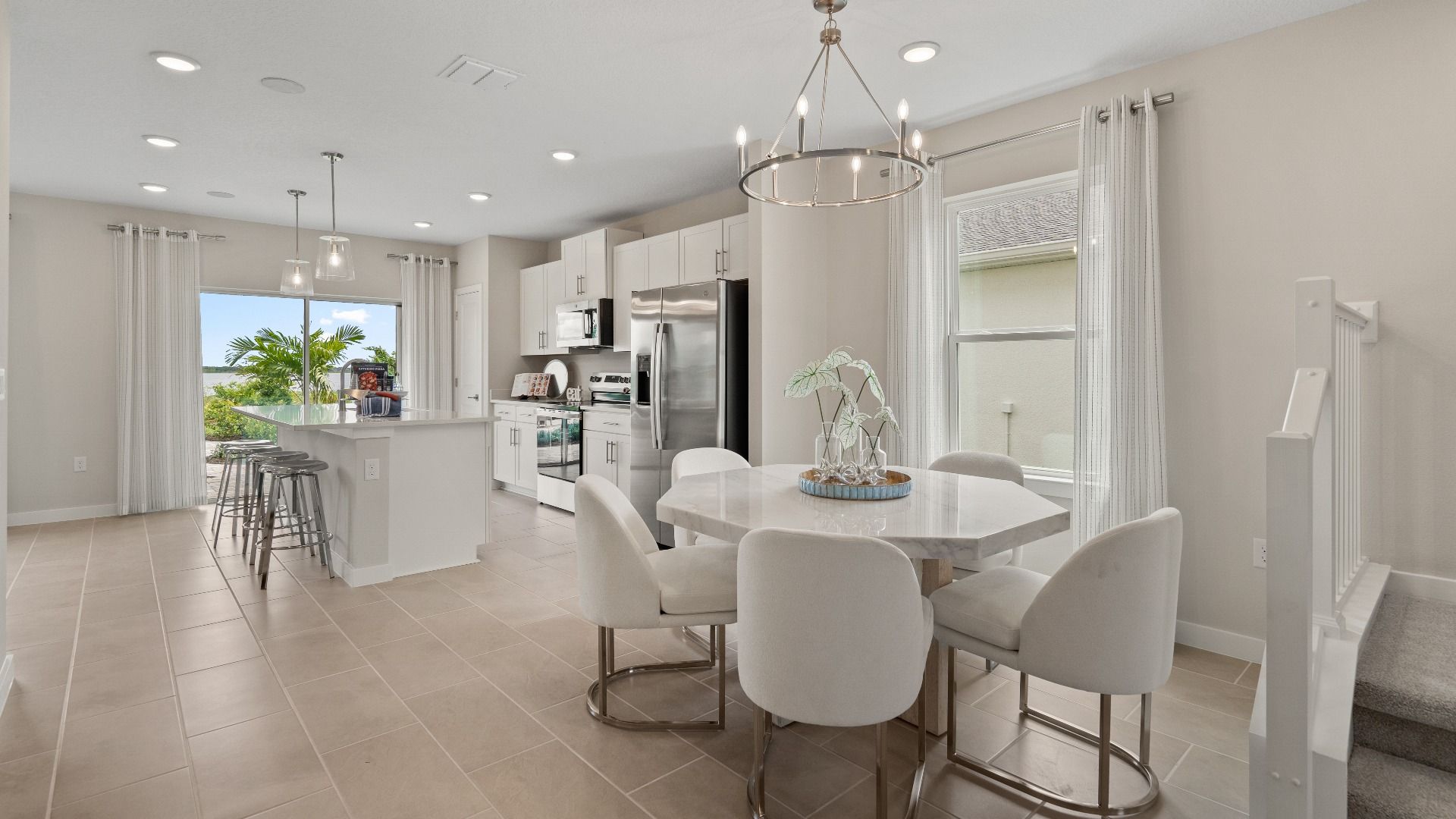 Ponte Vedra Model Home Dining Area and Kitchen at Willowbrook North by DRB Homes in Winter Haven FL