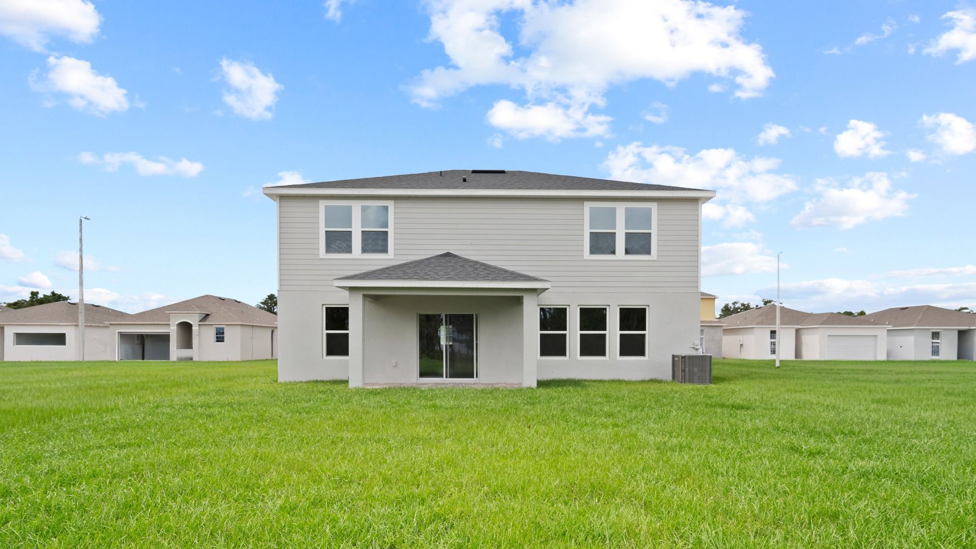 Highbourne Back Exterior by DRB Homes in Willowbrook North located on Lake Fannie in Winter Haven, FL.