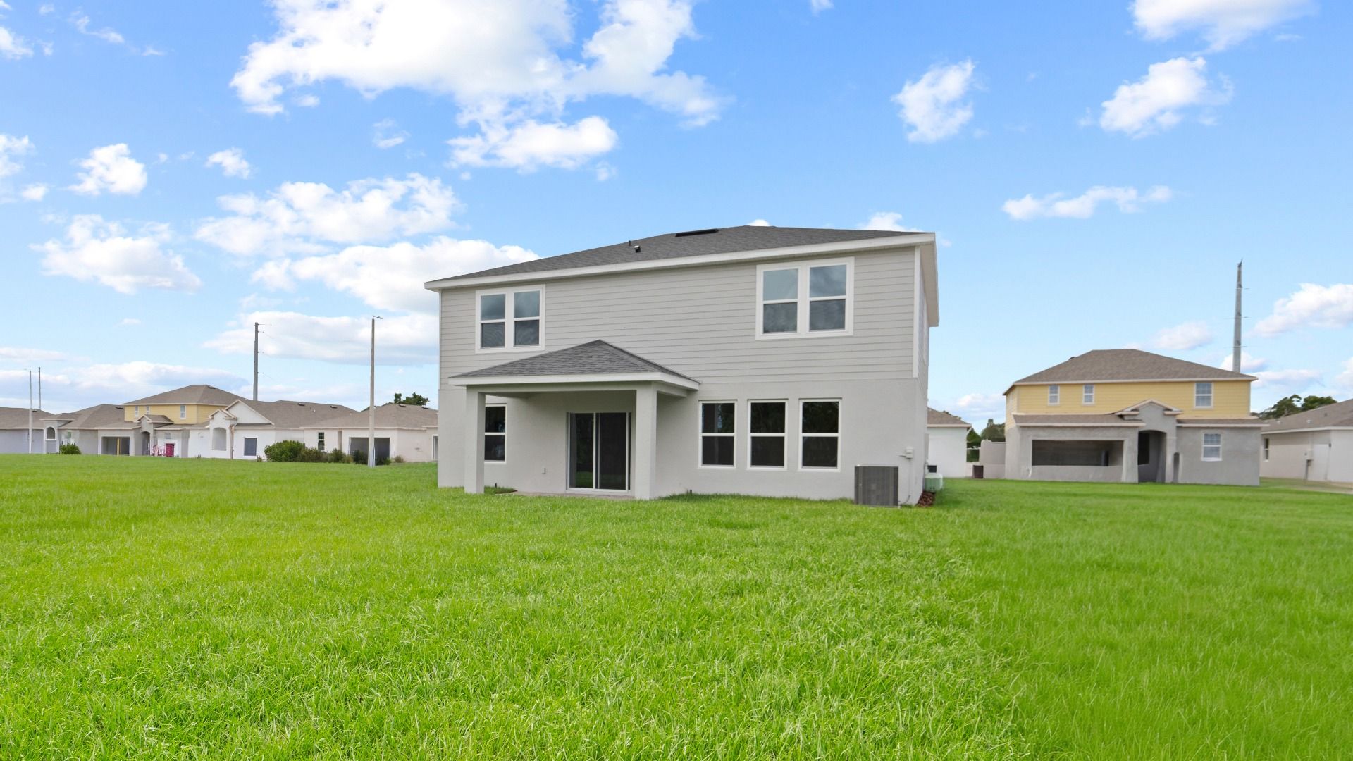 Highbourne Back Exterior by DRB Homes in Willowbrook North located on Lake Fannie in Winter Haven, FL.