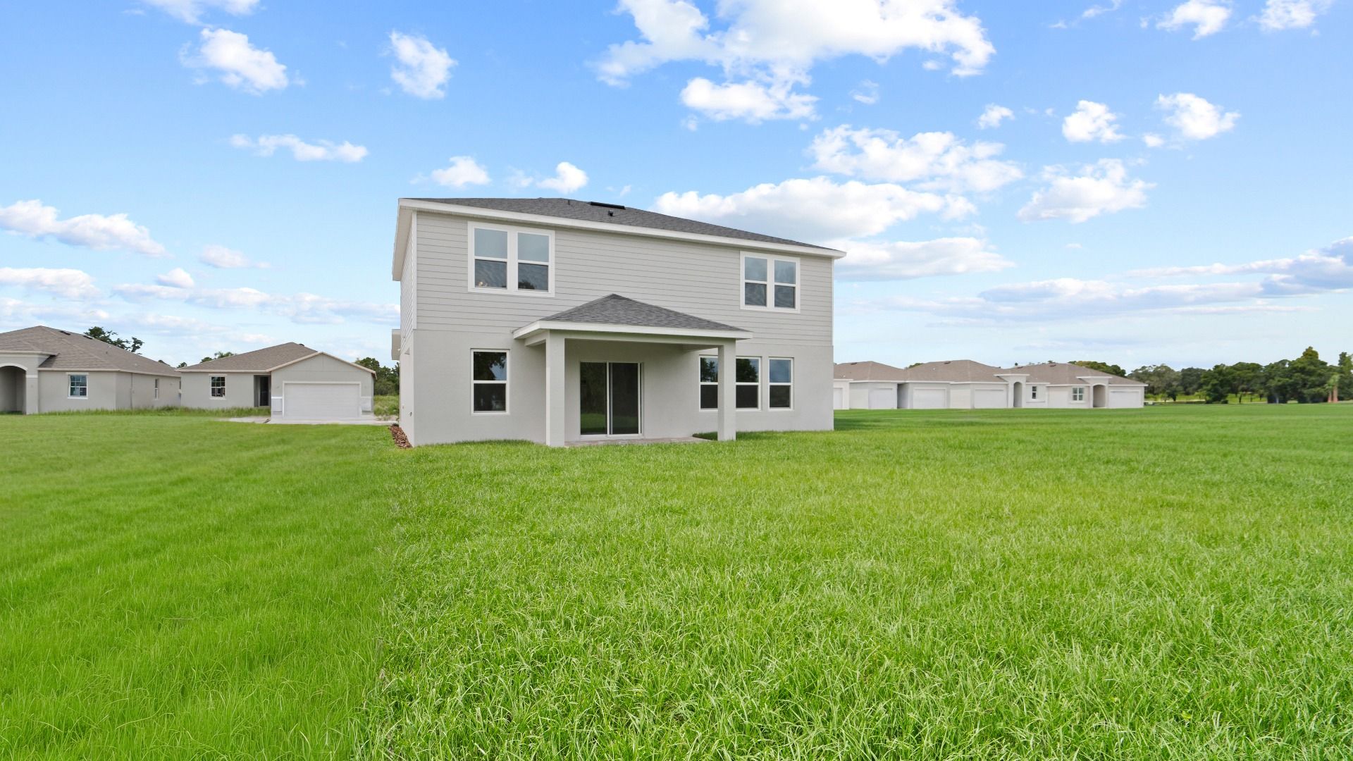 Highbourne Back Exterior by DRB Homes in Willowbrook North located on Lake Fannie in Winter Haven, FL.