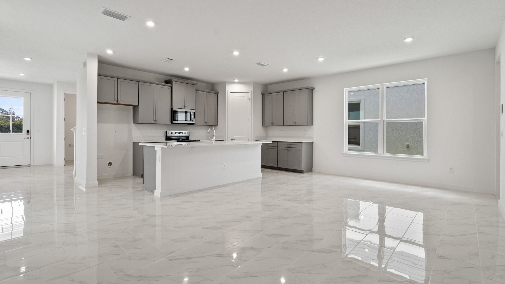 Mandarin view of the Kitchen and Living Area by DRB Homes in Trinity place by DRB Homes Orlando in Saint Cloud, FL