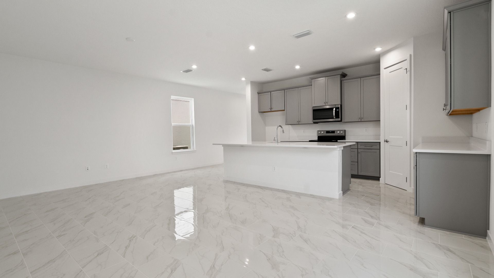 Mandarin view of the Kitchen and Living Area by DRB Homes in Trinity place by DRB Homes Orlando in Saint Cloud, FL