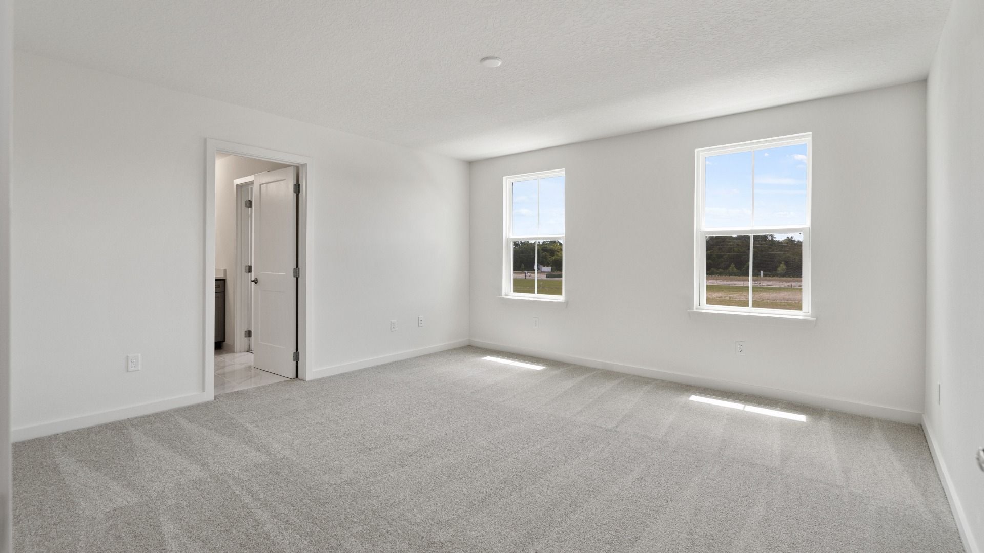 Large Primary Suite in the Mandarin model by DRB Homes at Trinity Place in Saint Cloud FL