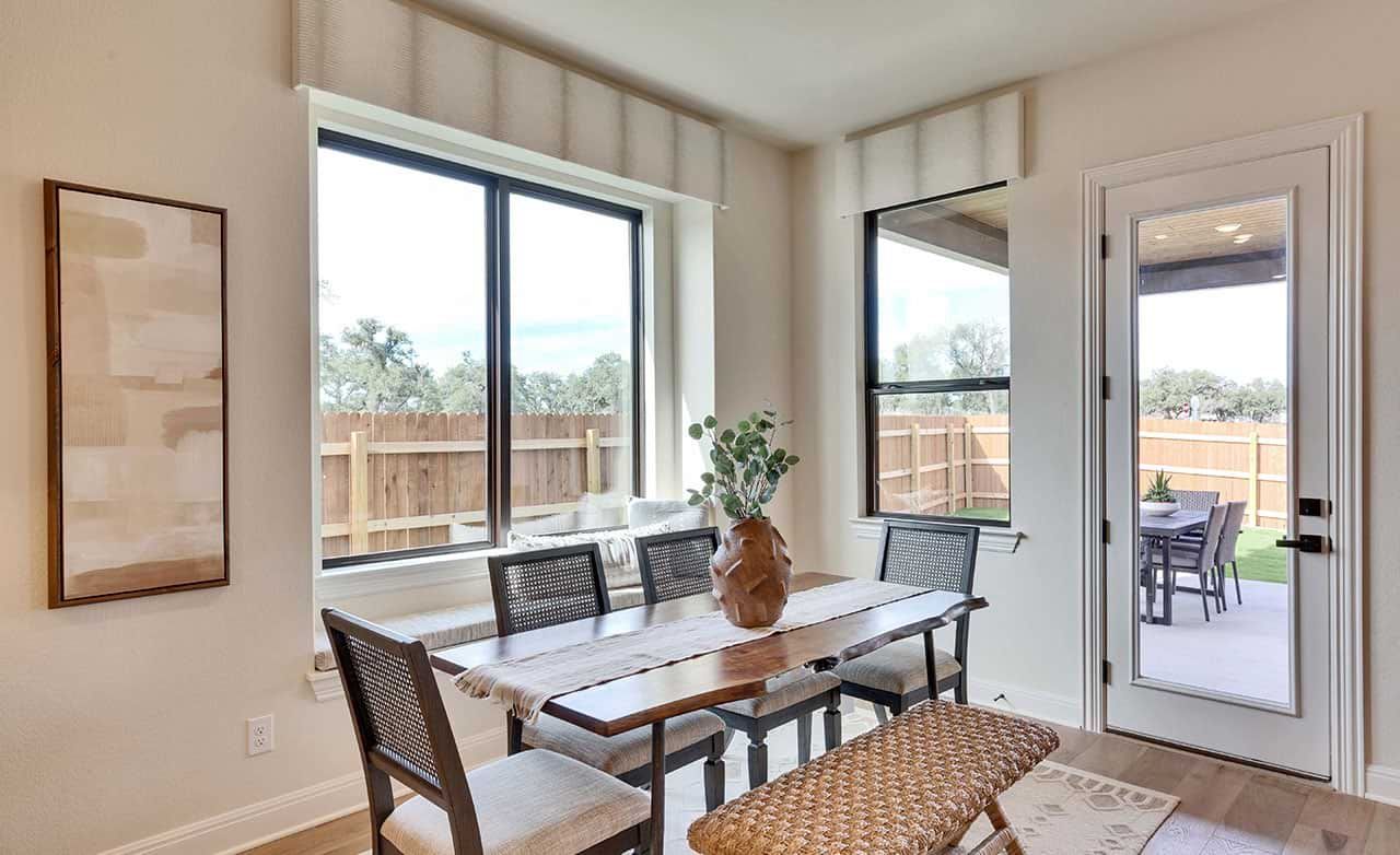 Experience elegance with expansive windows, wooden accents, and seamless patio access in San Gabriel estate.