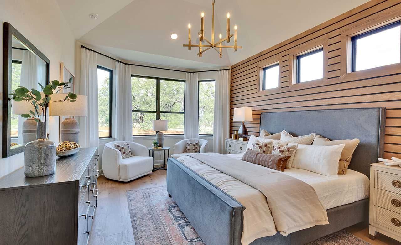 Indulge in elegant luxury with wood accents, plush textiles, and grand windows in the Retreat at San Gabriel.