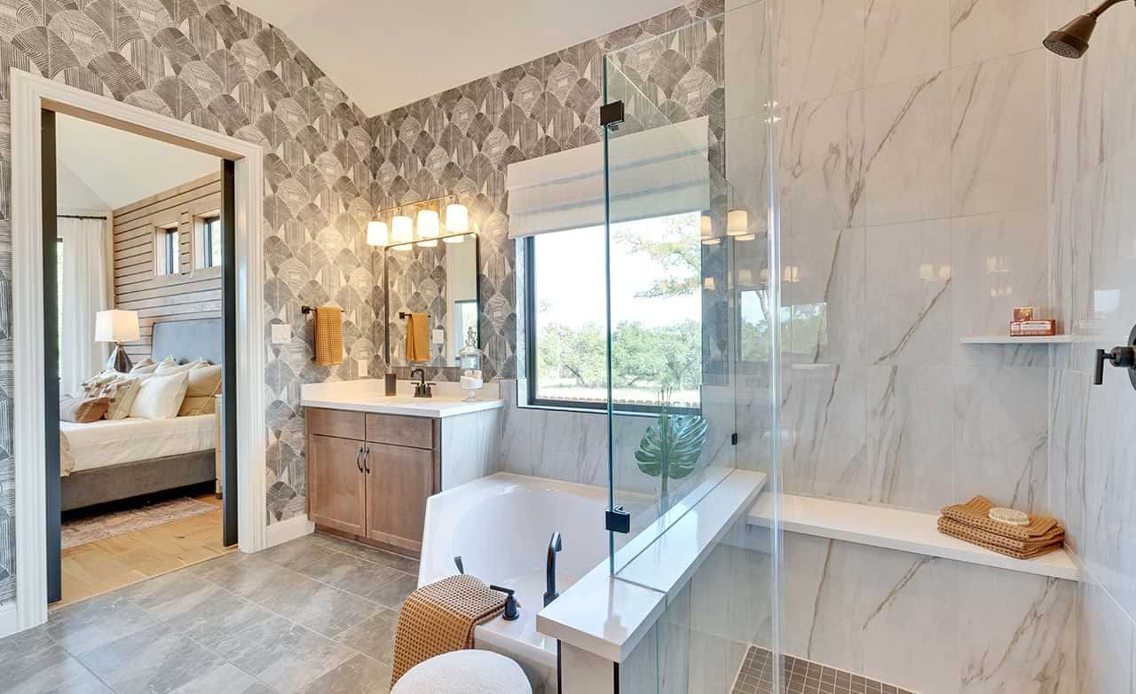 Indulge in marble elegance and a glass-enclosed shower, offering sophistication and scenic views in San Gabriel.