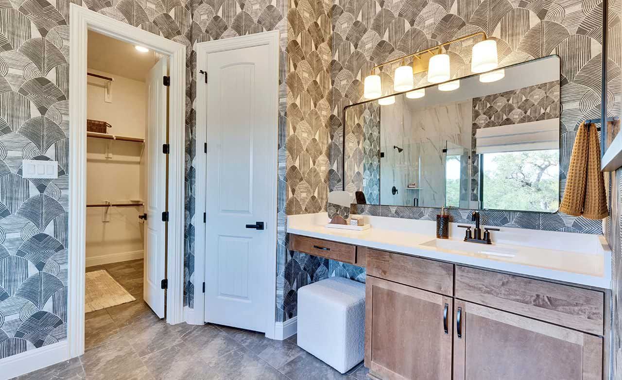 Experience elegance with geometric wallpaper, rich wood cabinetry, and premium fixtures at San Gabriel's finest residences.