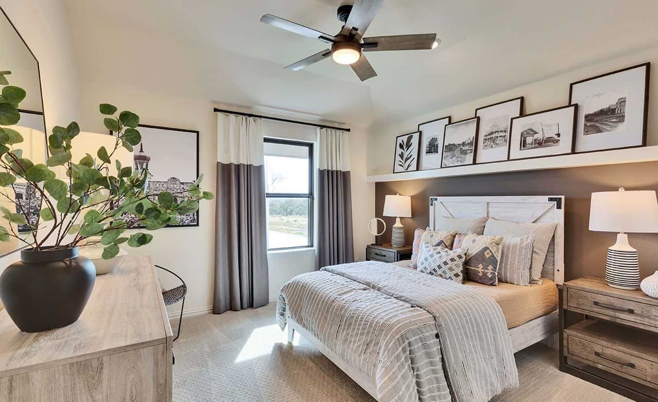 Elegant bedroom features plush textures and curated art, epitomizing luxury at Retreat at San Gabriel.