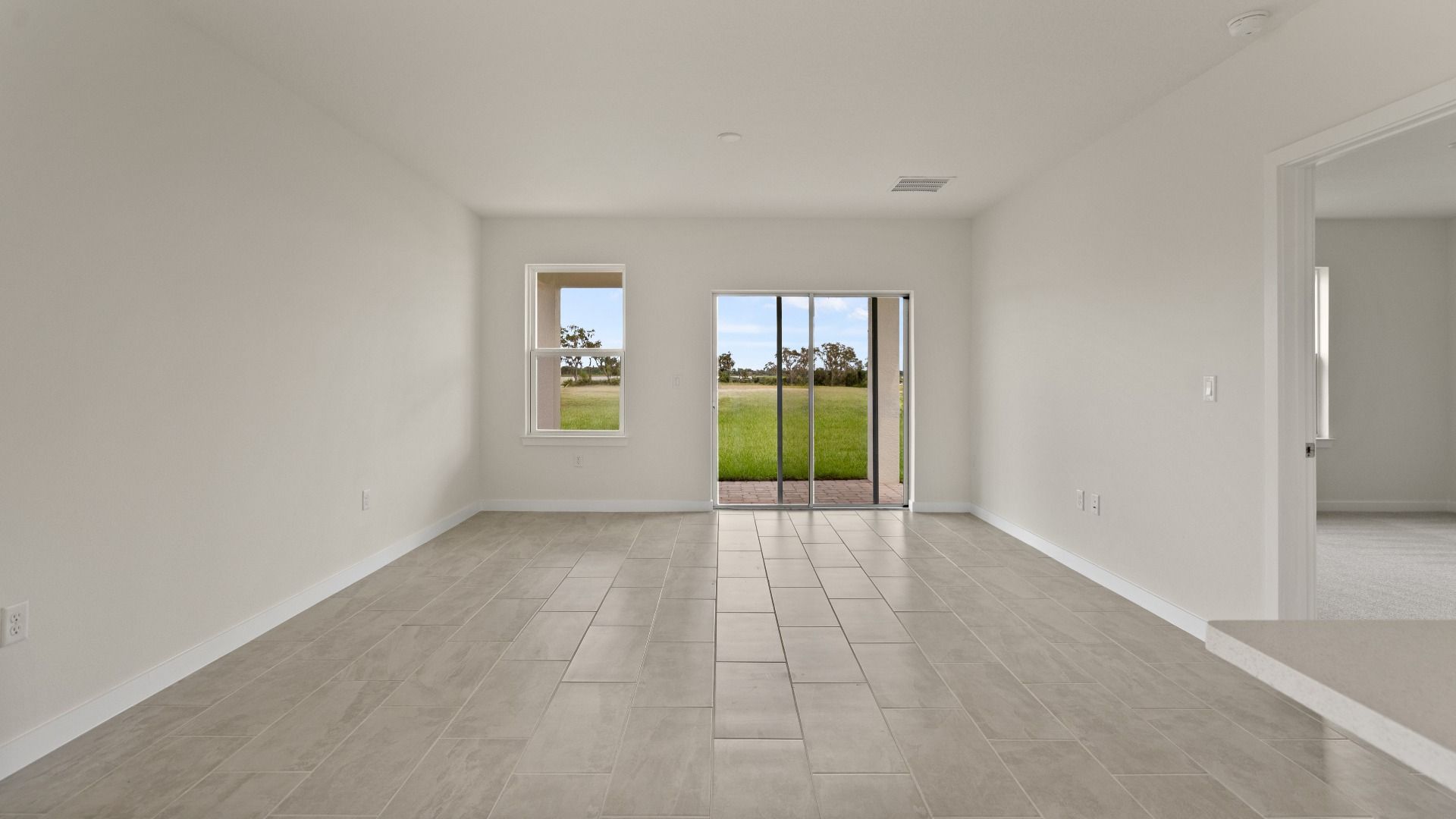 The Naples Living Area Quick Move-In Home at Willowbrook North by DRB Homes in Winter Haven, FL