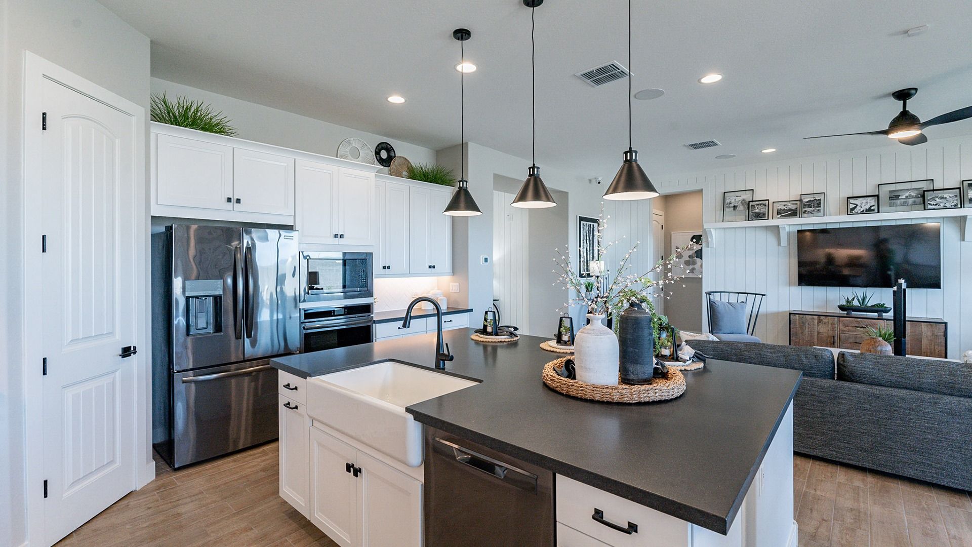 Exquisite modern kitchen with sleek island, pendant lighting, and premium appliances in Arroyo Seco.