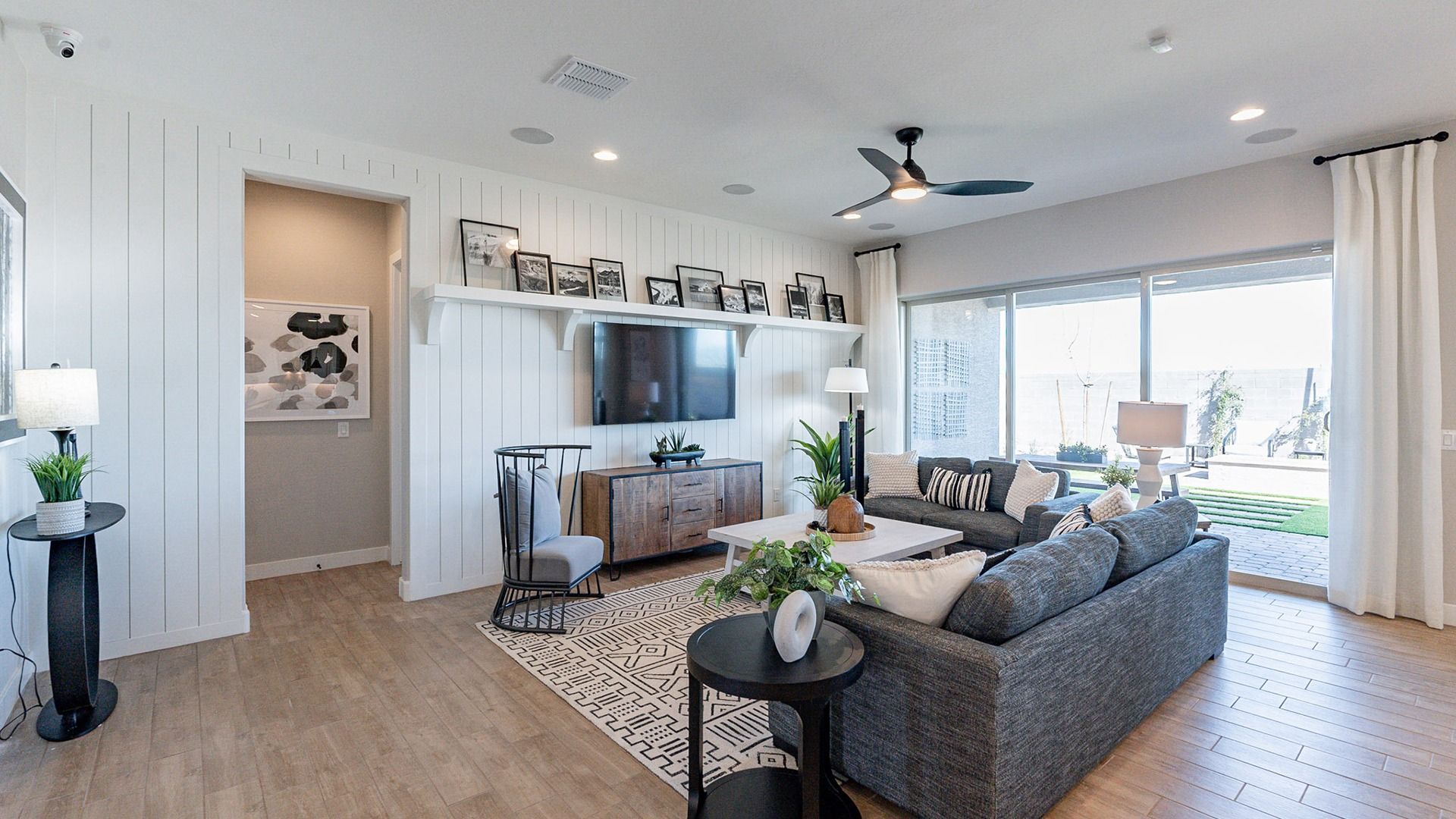 Enjoy elegantly layered shiplap walls and expansive glass views in Arroyo Seco's luxurious setting.