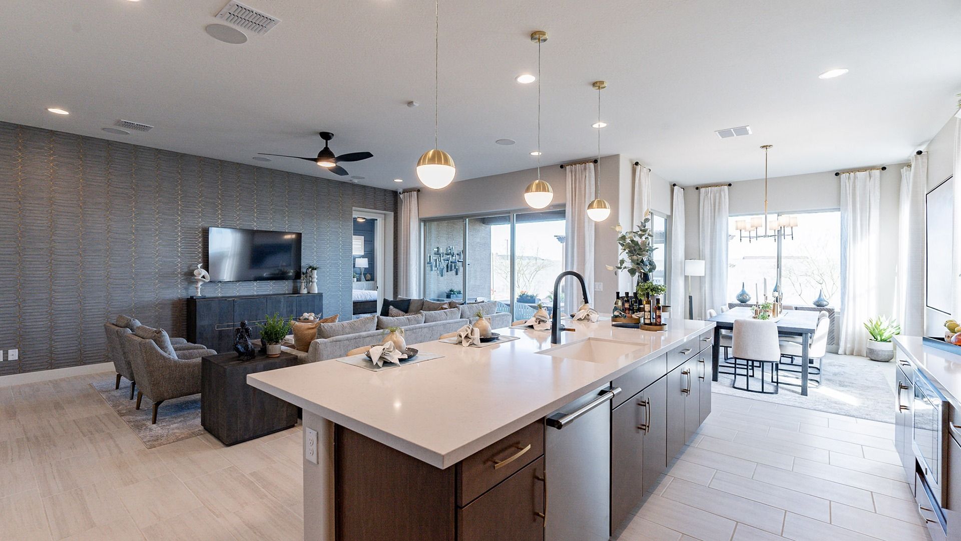 Experience luxury in this Arroyo Seco residence with custom cabinetry, sleek countertops, and expansive windows.