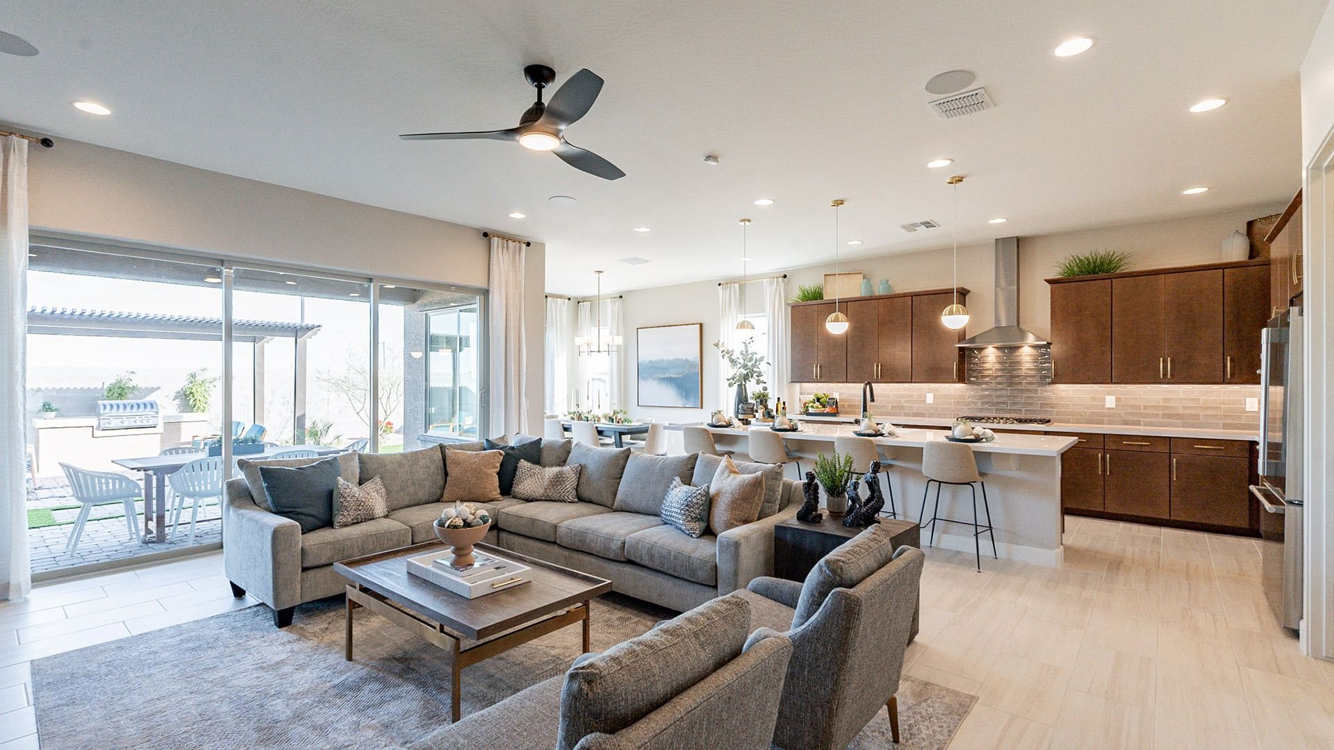 Open-concept layout with sleek cabinetry, luxurious finishes, and expansive windows in Arroyo Seco.