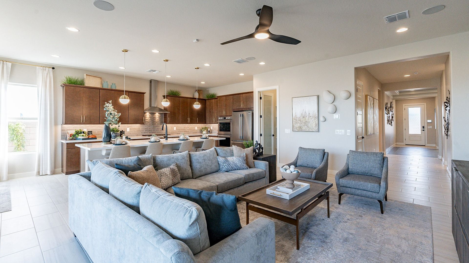 Luxurious interiors feature elegant pendant lighting and rich wood cabinetry in Arroyo Seco.