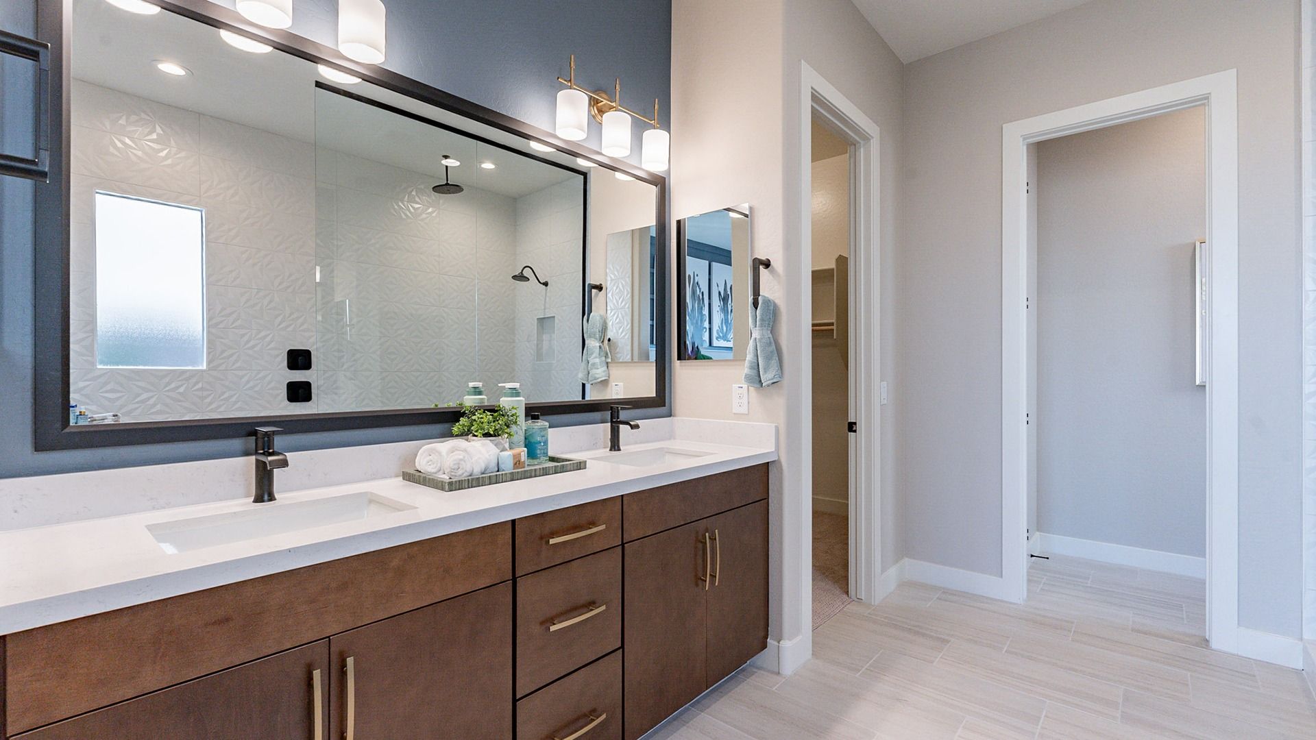 Exquisite double vanity with modern fixtures and walk-in shower in Arroyo Seco's Hacienda community.