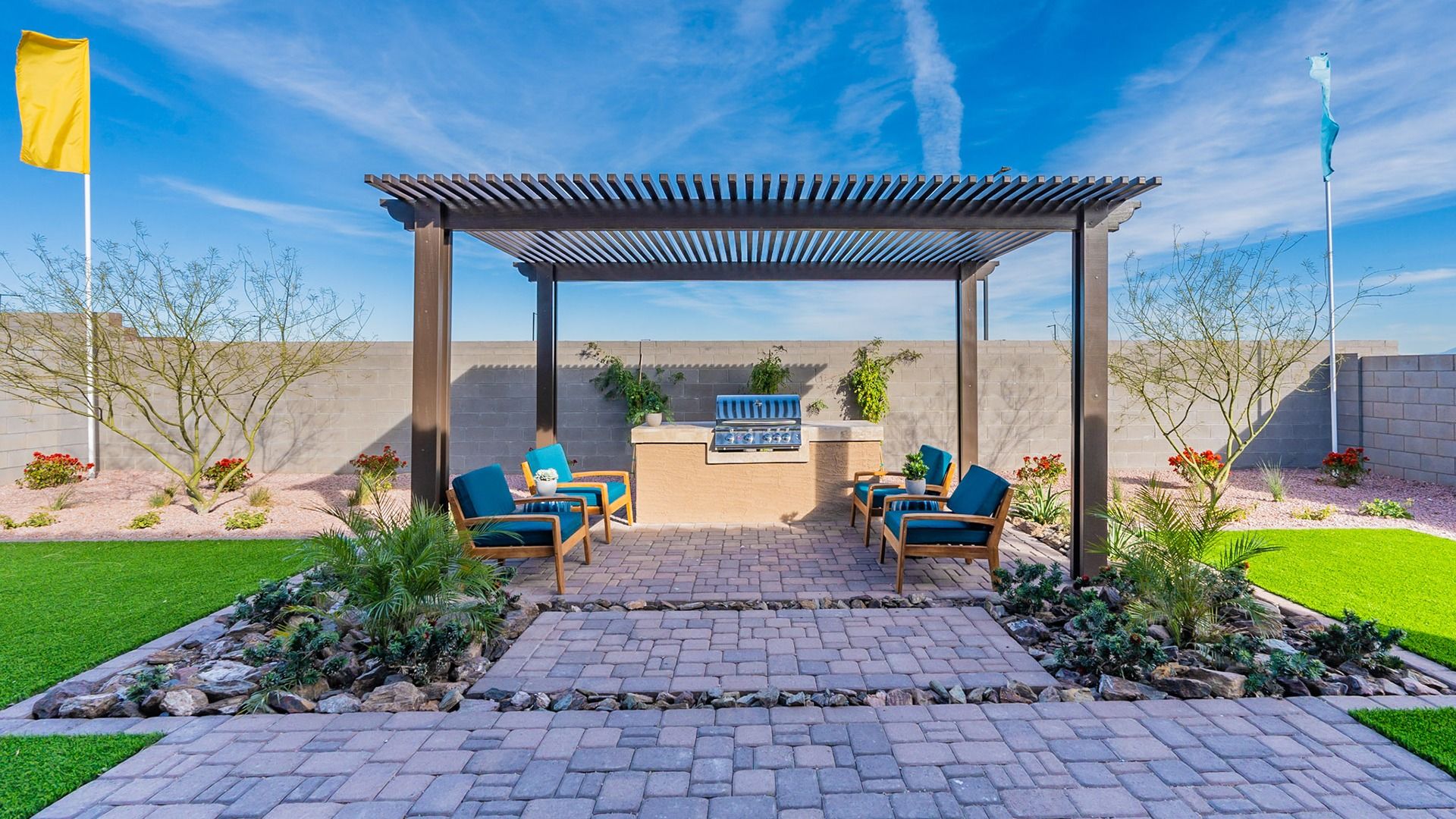 Elegant pergola and sophisticated grill area in luxurious Arroyo Seco Hacienda backyard, framed by refined desert landscape.