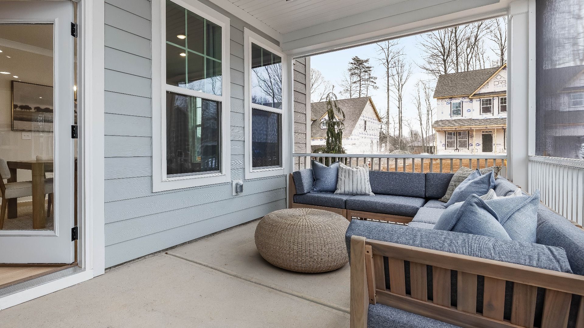 Stonefield home plan rear screened in porch with ceiling fan