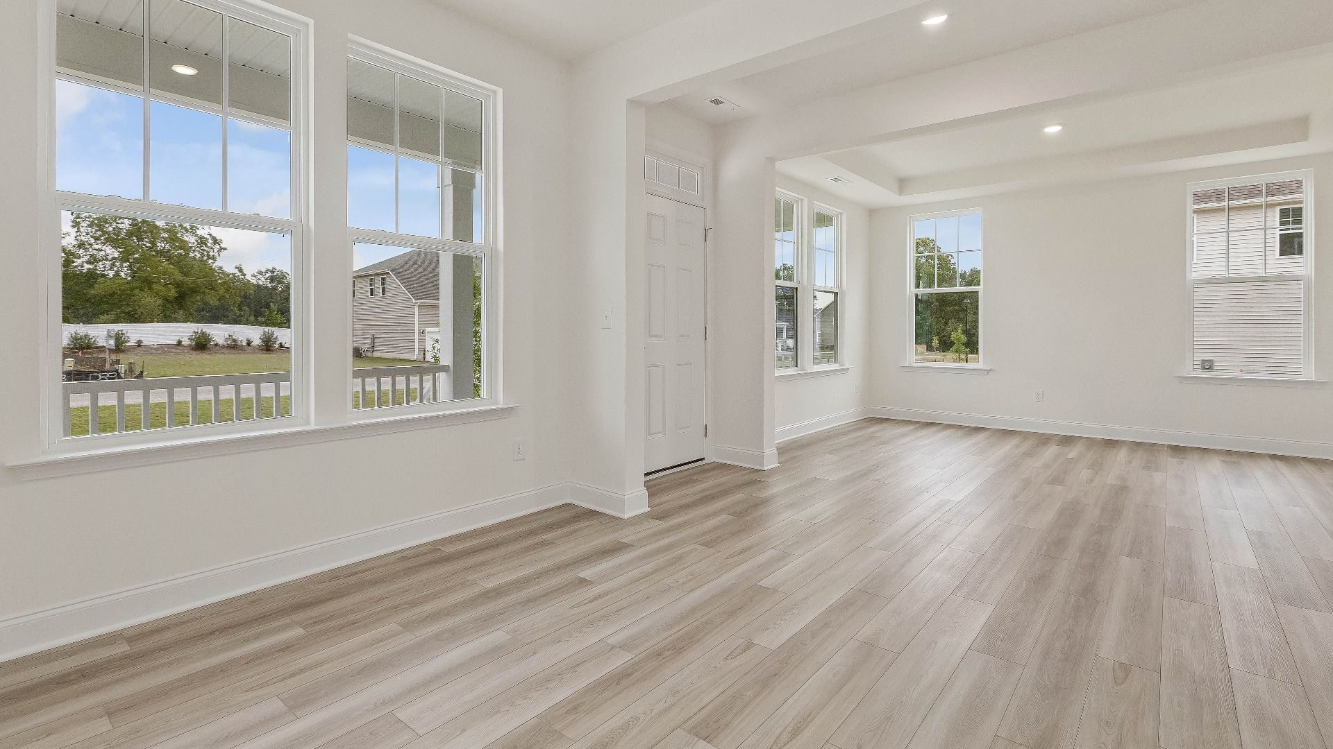 Stonehaven home plan front entry with adjacent formal dining room and flex space
