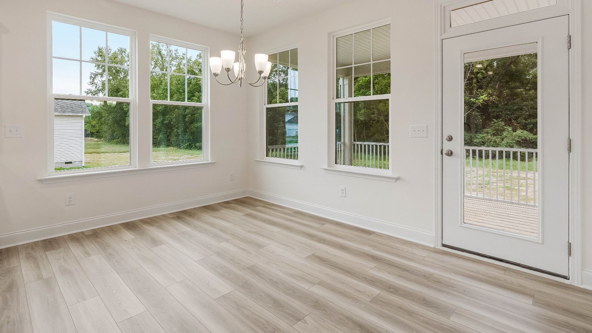 Stonehaven home plan breakfast area adjacent to the kitchen with access to rear porch