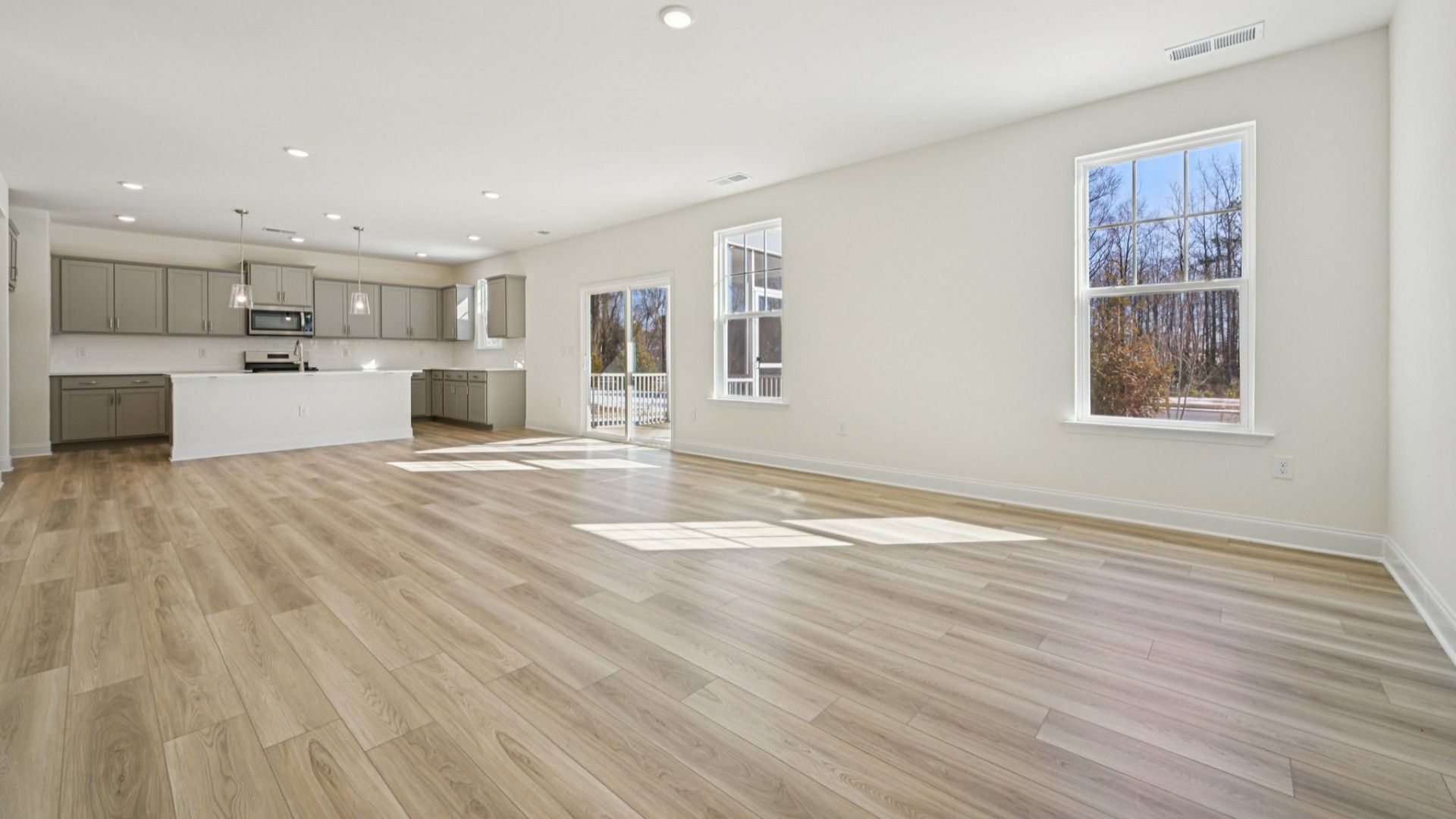 Wagener home plan large living/family room connecting to the island kitchen and back patio access