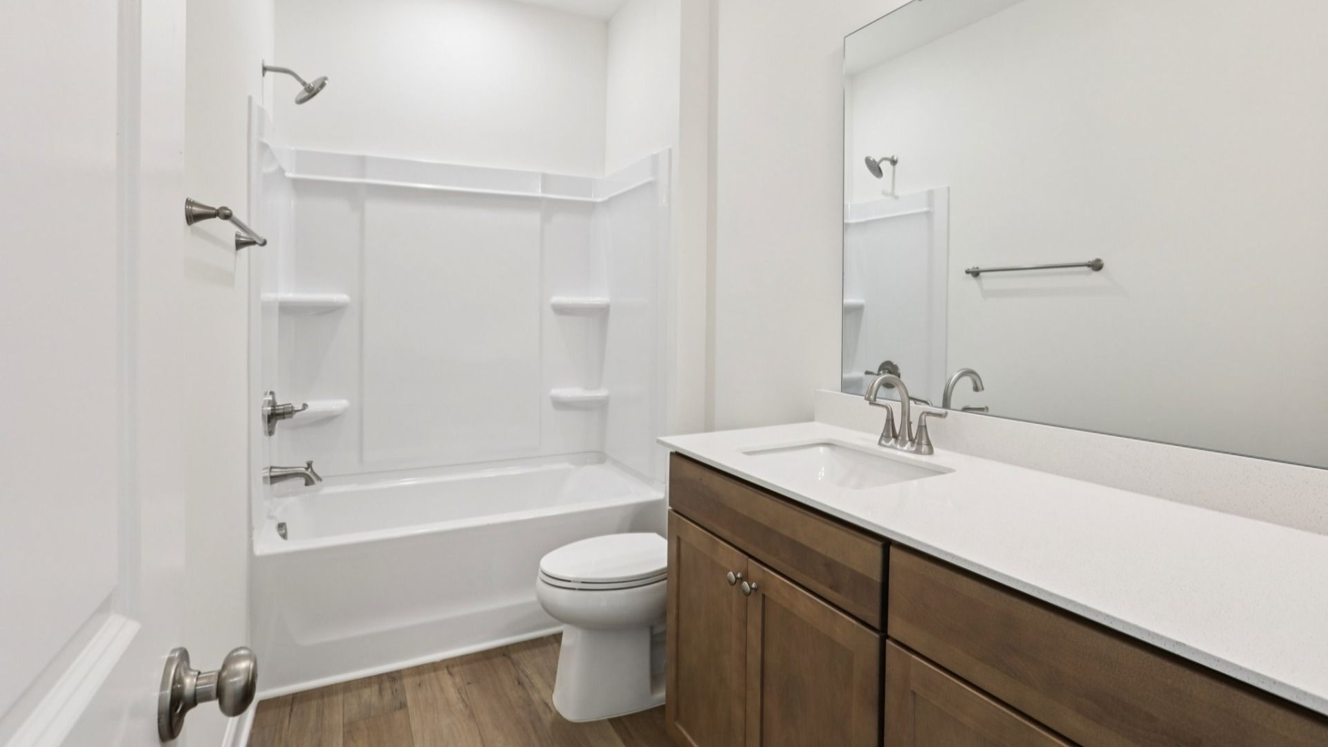 Pendleton home plan secondary bathroom with large vanity and shower
