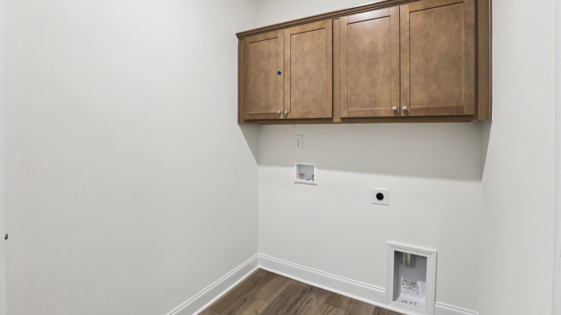Pendleton home plan conveniently located laundry room with cabinetry