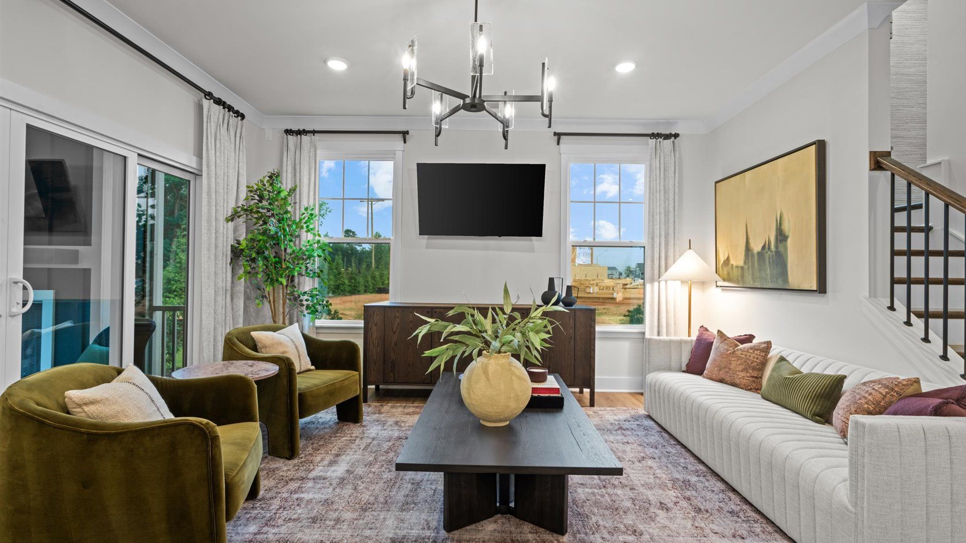 Pelham home plan open concept living room/family room with natural lighting and back porch access