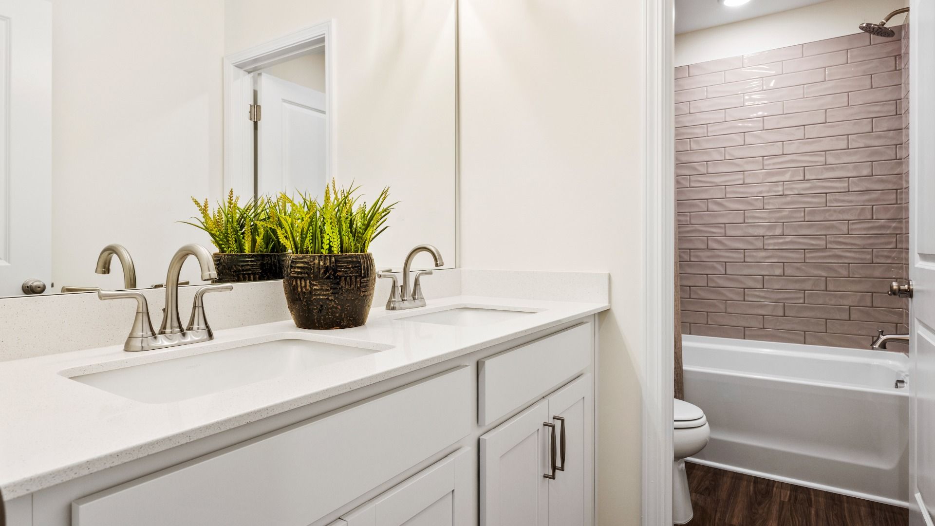 Townsend home plan secondary bathroom with dual vanities and tile shower