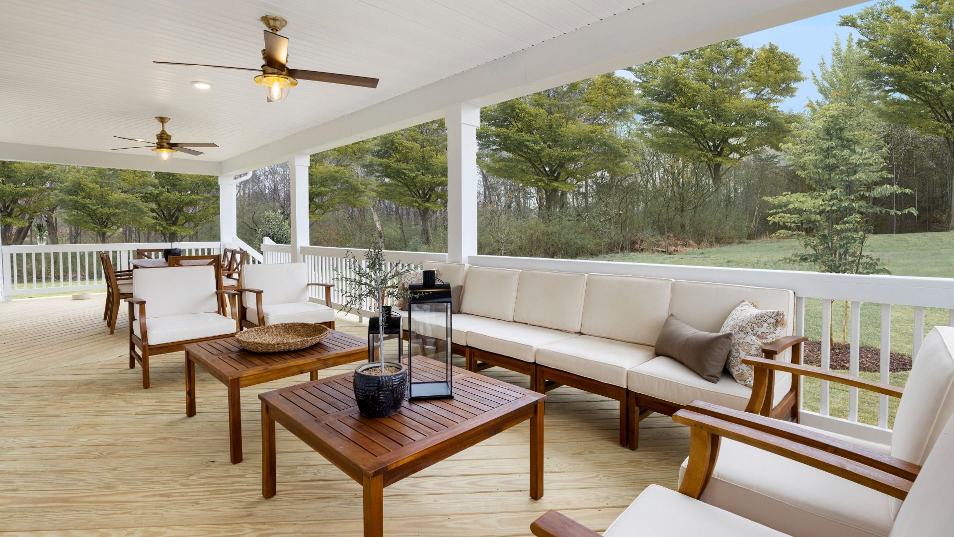 Townsend home plan covered back porch with ceiling fans spanning entire length of the home for optimal outdoor living
