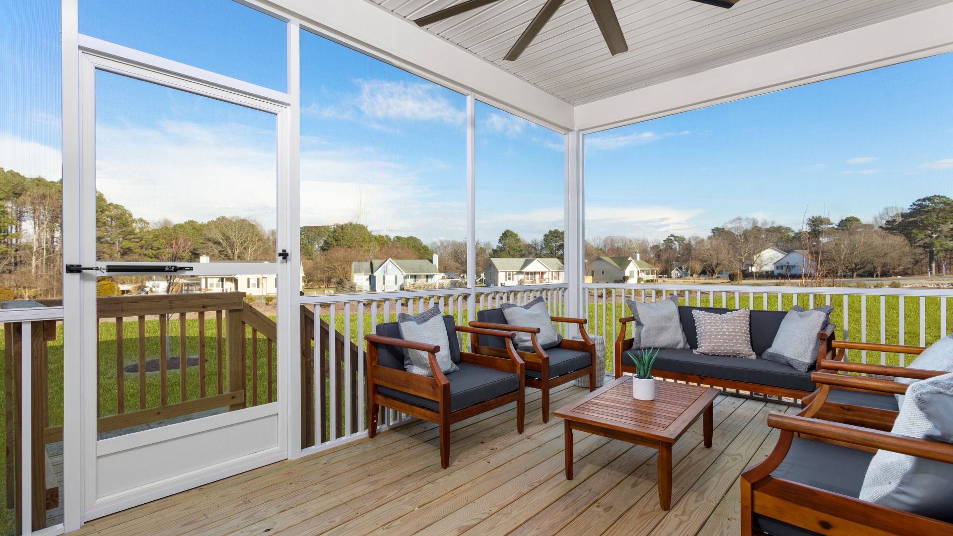 Stonefield home plan rear screened in porch with ceiling fan