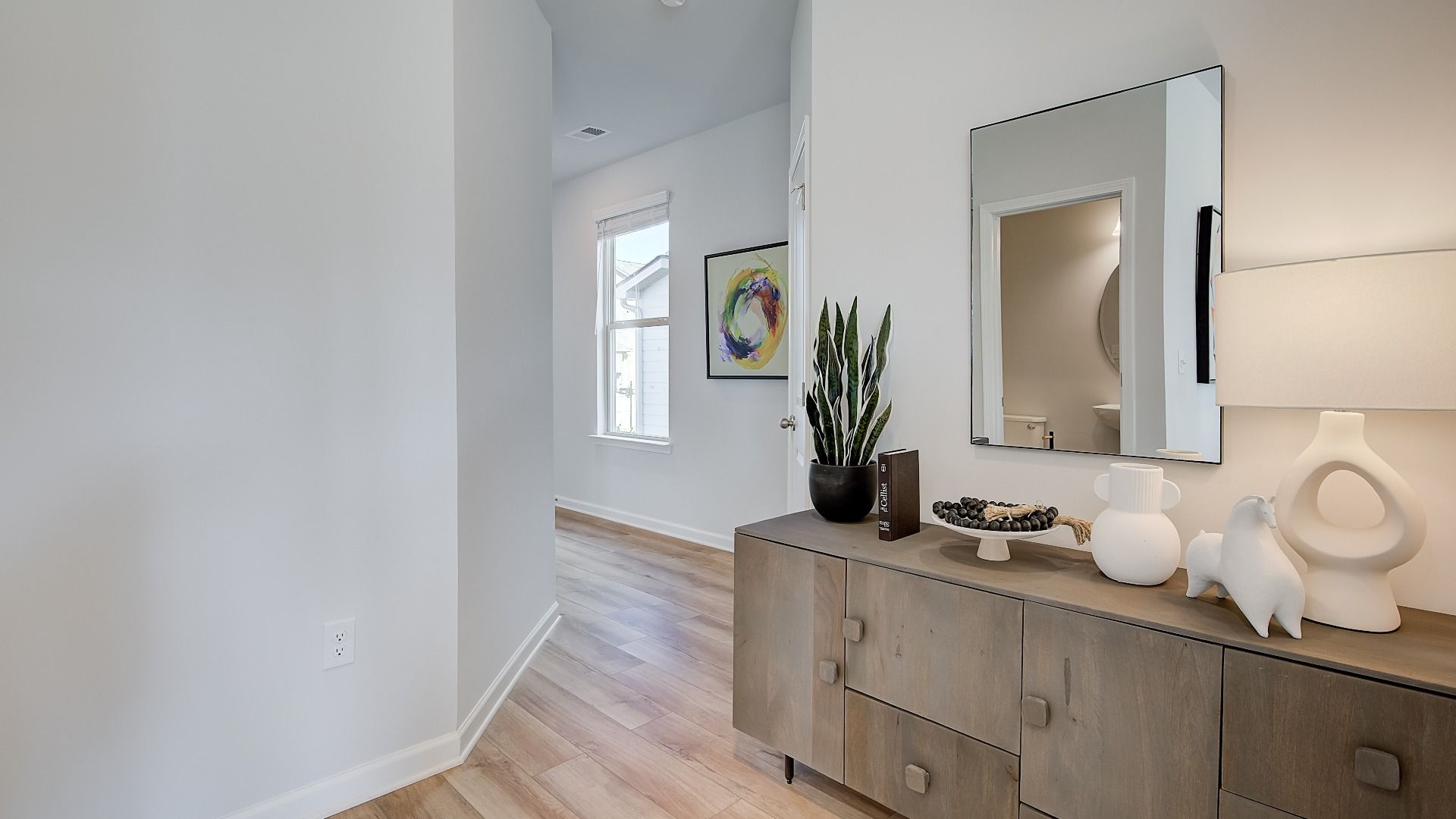 Welcoming interior entryway with high ceilings, coat closet, and open sightlines into main living area.