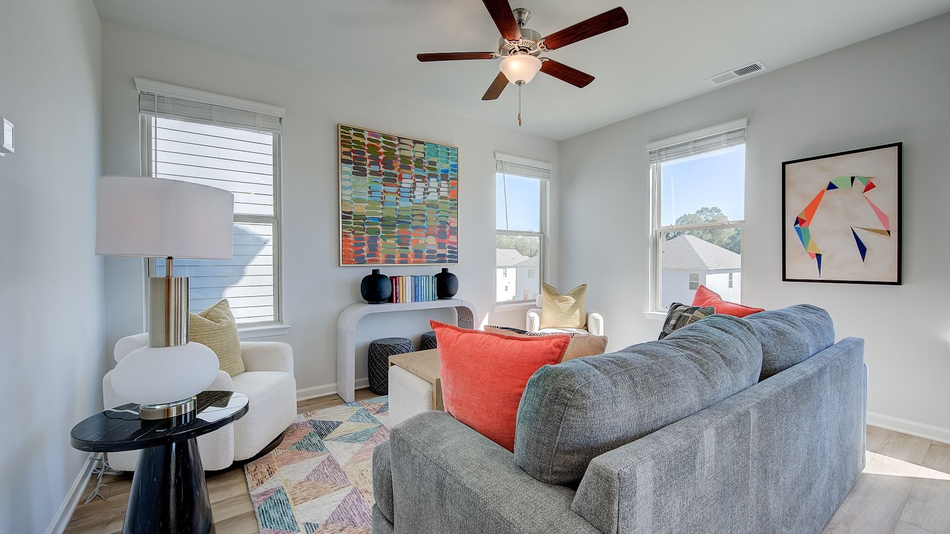 Spacious family room with an open layout and LVP flooring in Opelika, AL home.