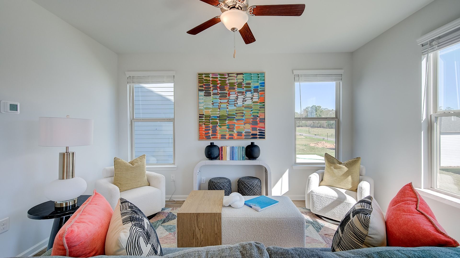 Spacious family room with an open layout and LVP flooring in Opelika, AL home.