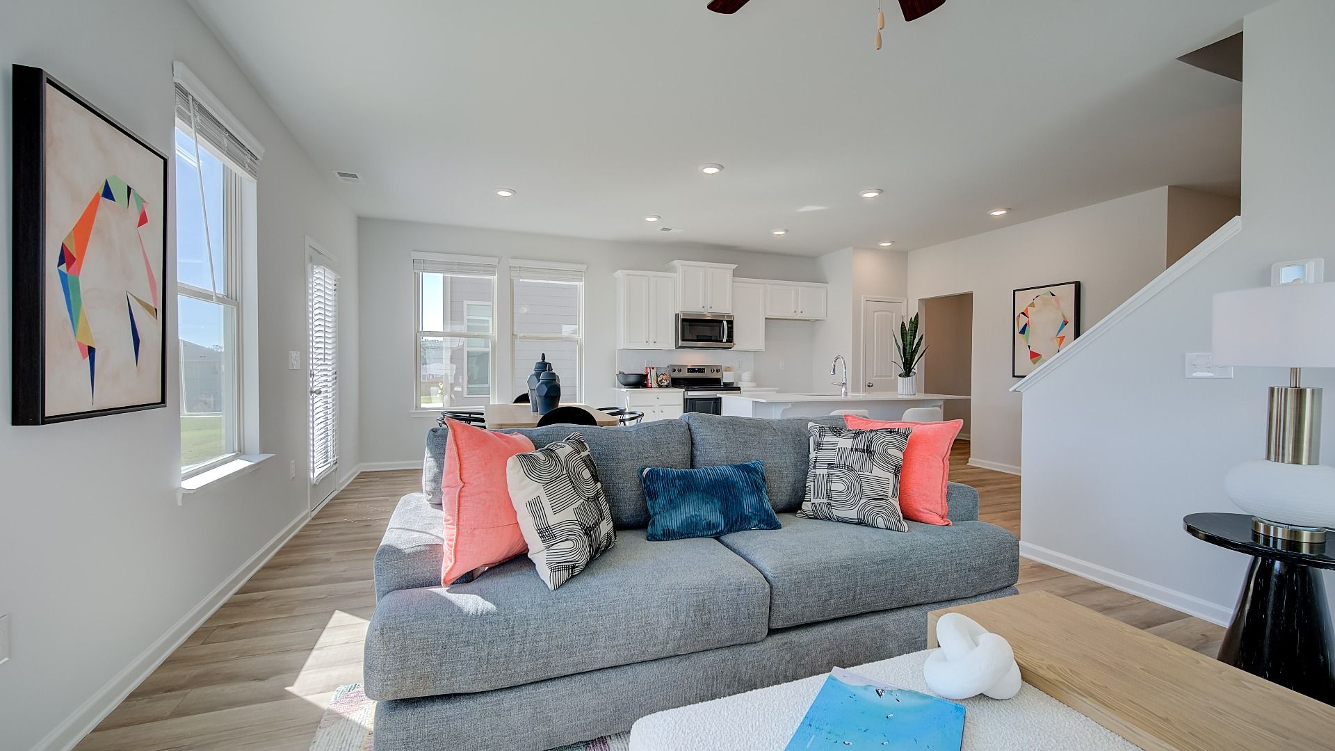 Spacious family room with an open layout and LVP flooring in Opelika, AL home.