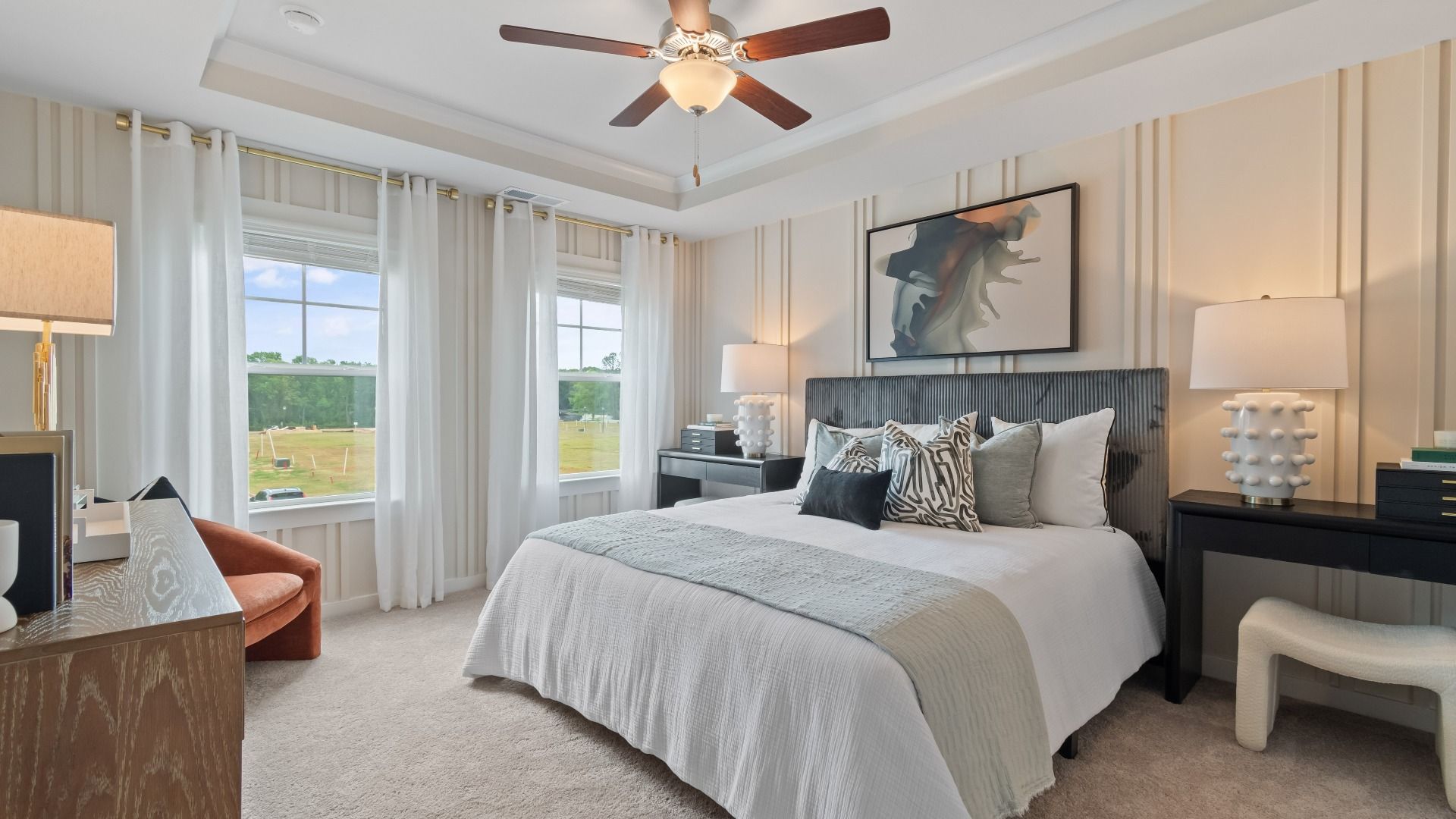 Primary suite with tray ceiling and natural light in new construction townhome at Avery Landing in McDonough, GA