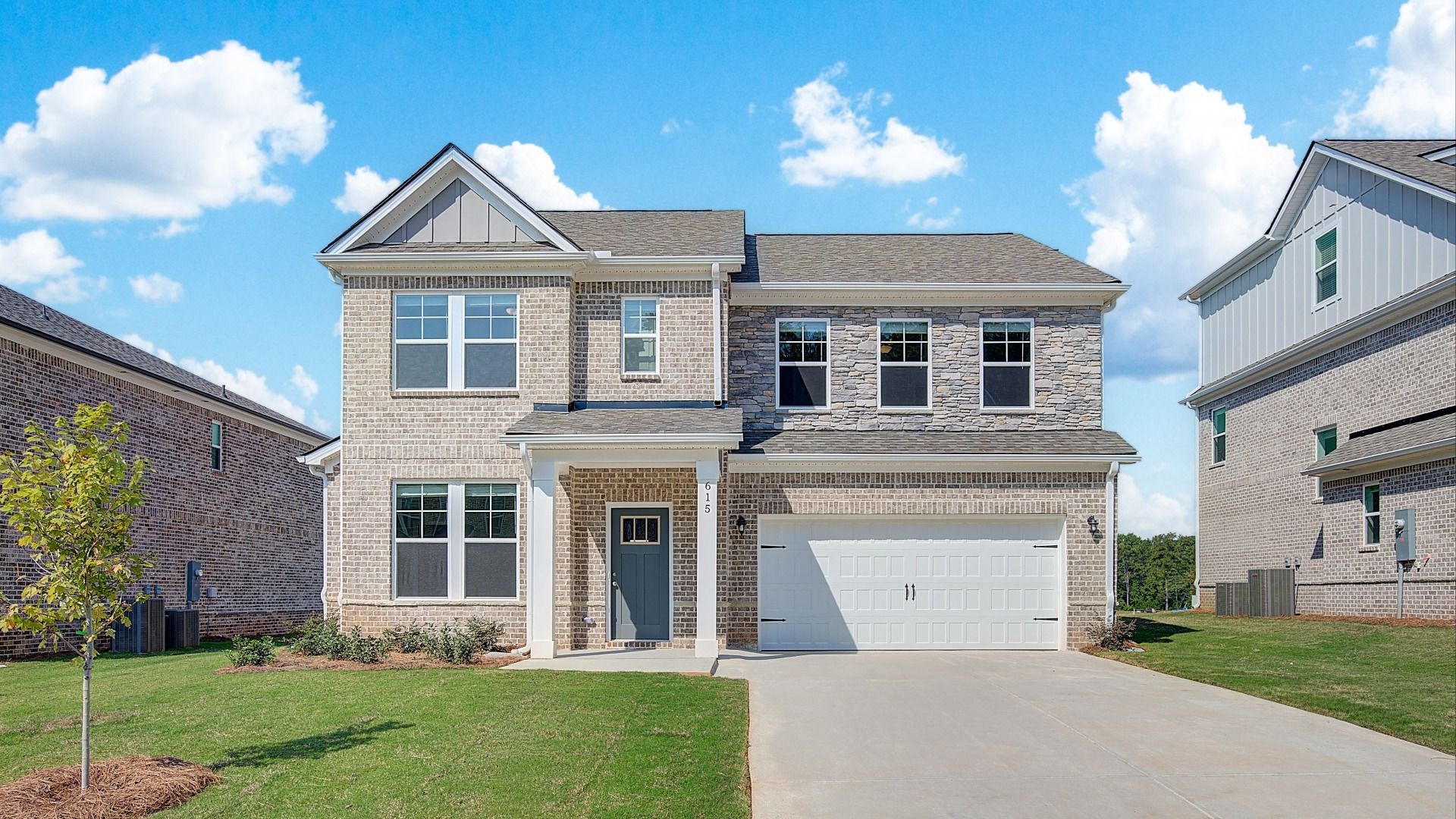 Front exterior view of Ridgewood new construction home plan at Bowers Farm featuring 4-sided brick and 2-car garage.