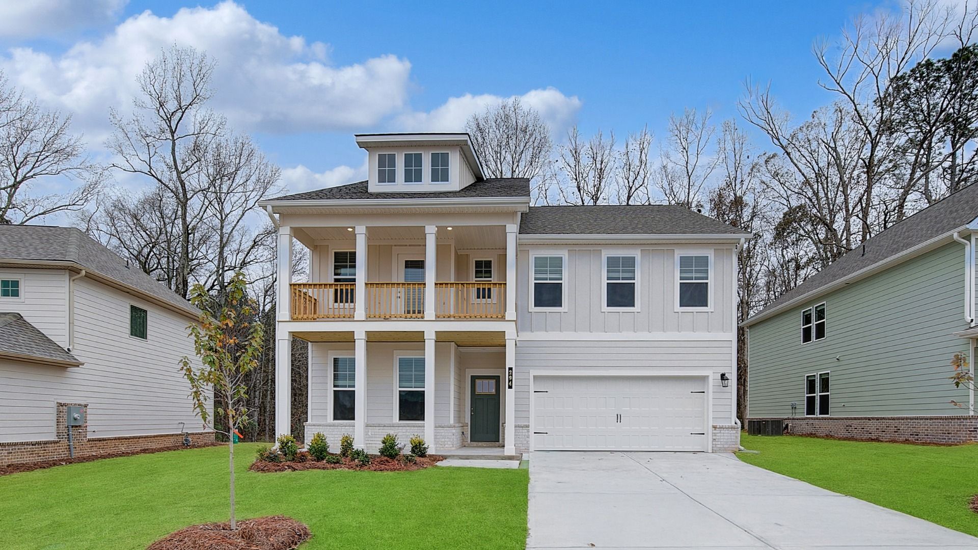 Wagener model two-story home with siding exterior and balcony at Cooper Park in McDonough, GA.