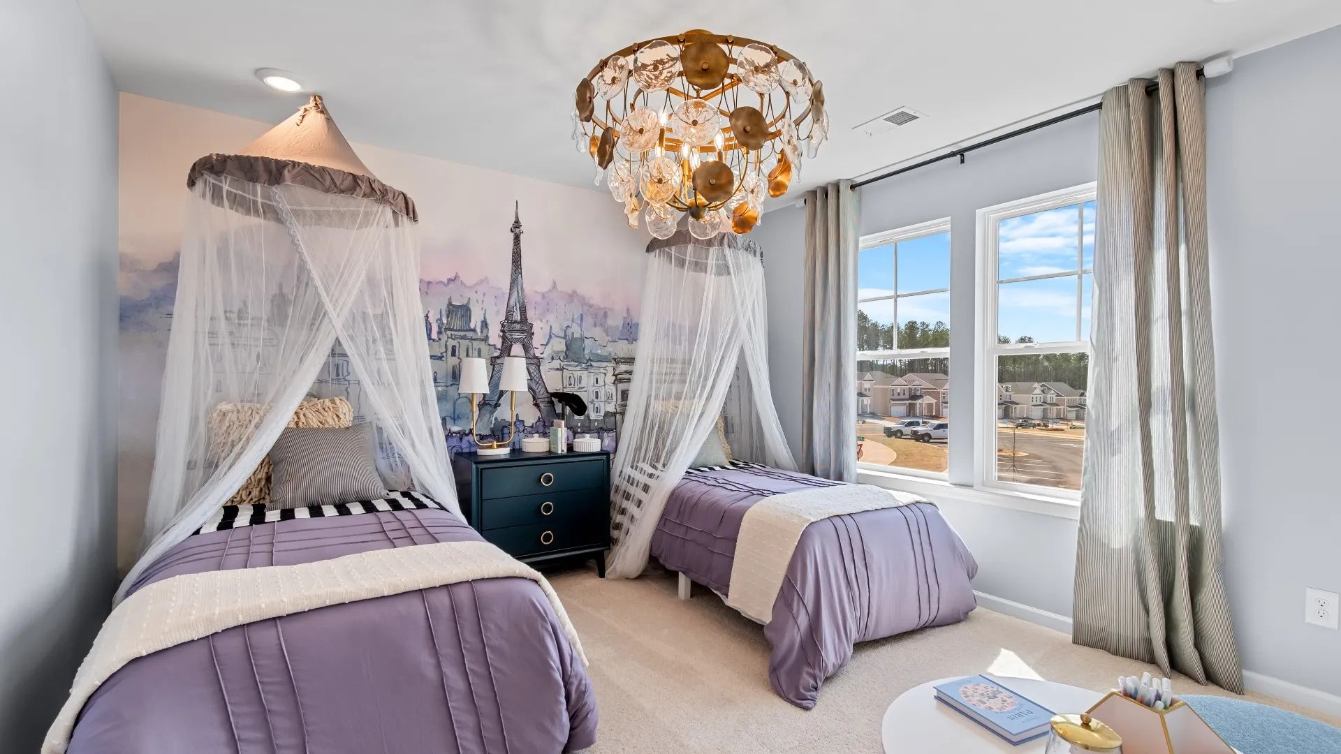 Comfortable secondary bedroom featuring natural light and neutral finishes at Bowers Farm in McDonough, GA.