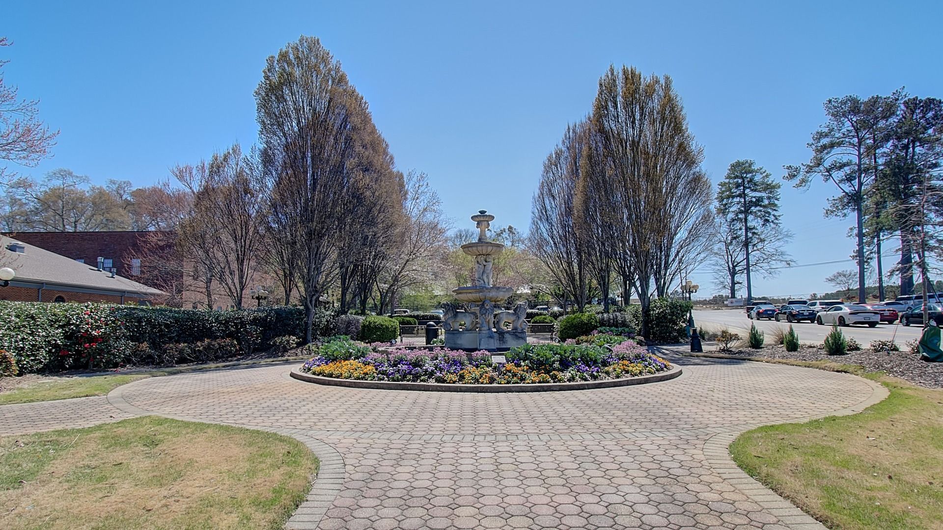Charming Municipal Park with mature trees, fountain, and landscaped flowers near the Diamante community in Stockbridge, GA.
