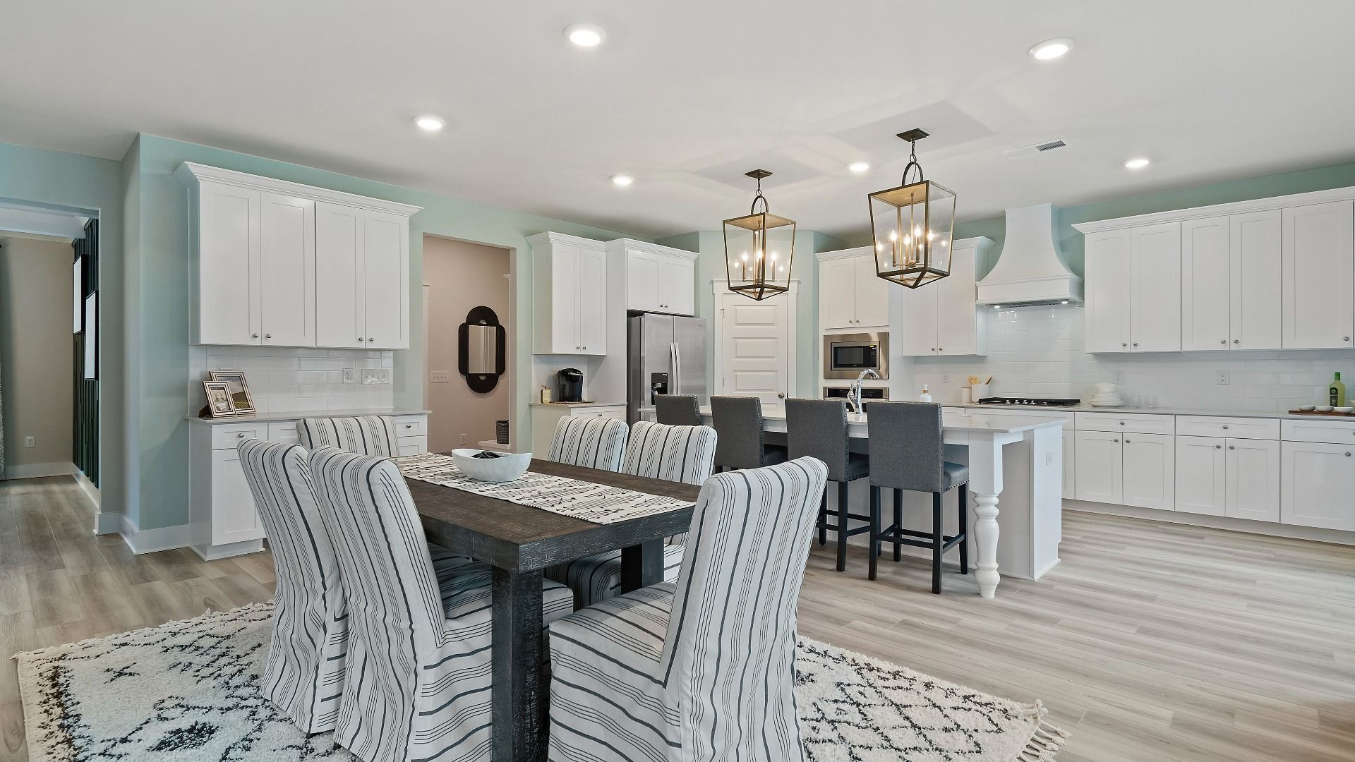 Open-concept kitchen layout with spacious breakfast area in new construction single family home at Saddleridge.