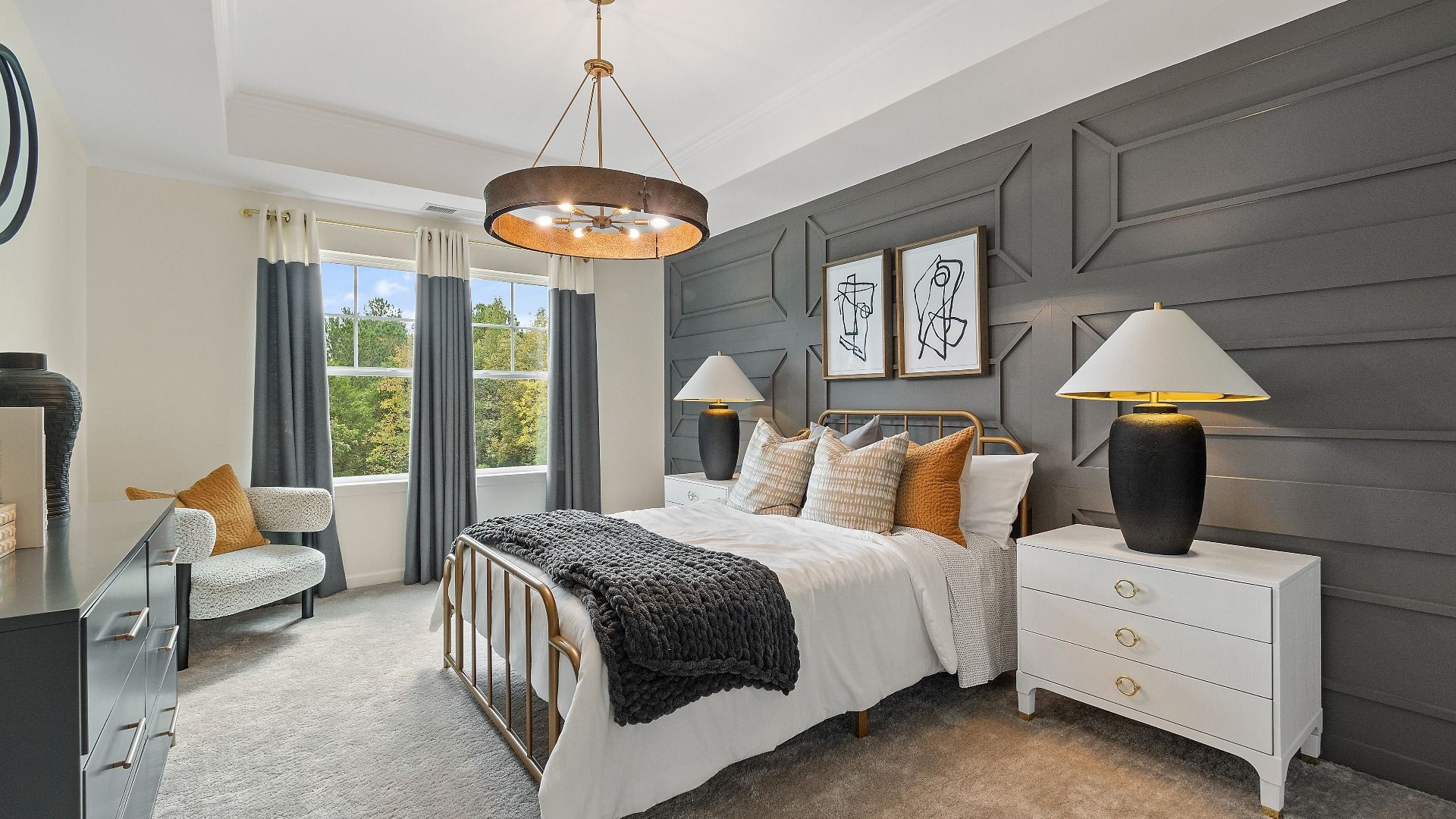 Secondary bedroom with tray ceiling, modern finishes, and carpet flooring at Trinity Park in McDonough, GA.