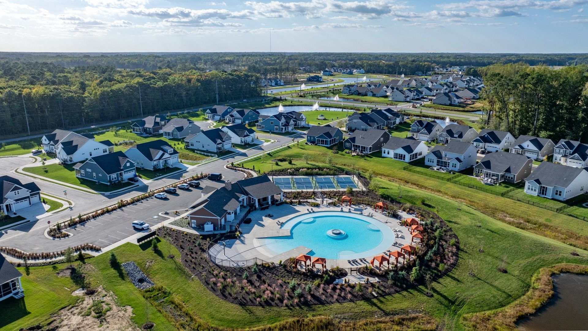 Pool, clubhouse  and tennis courts at the DRB Homes community of Chase Oaks in Lewes, Delaware.