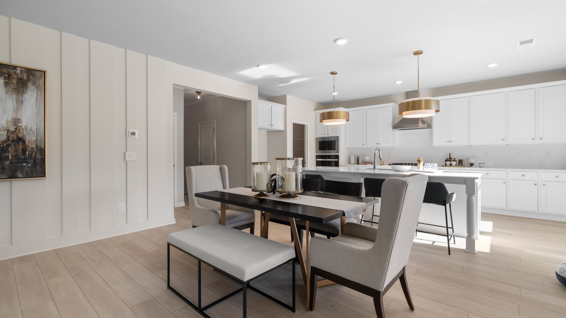 Spacious breakfast area with comfortable seating and open connection to the kitchen in the Ridgewood at Abbotts Crossing.