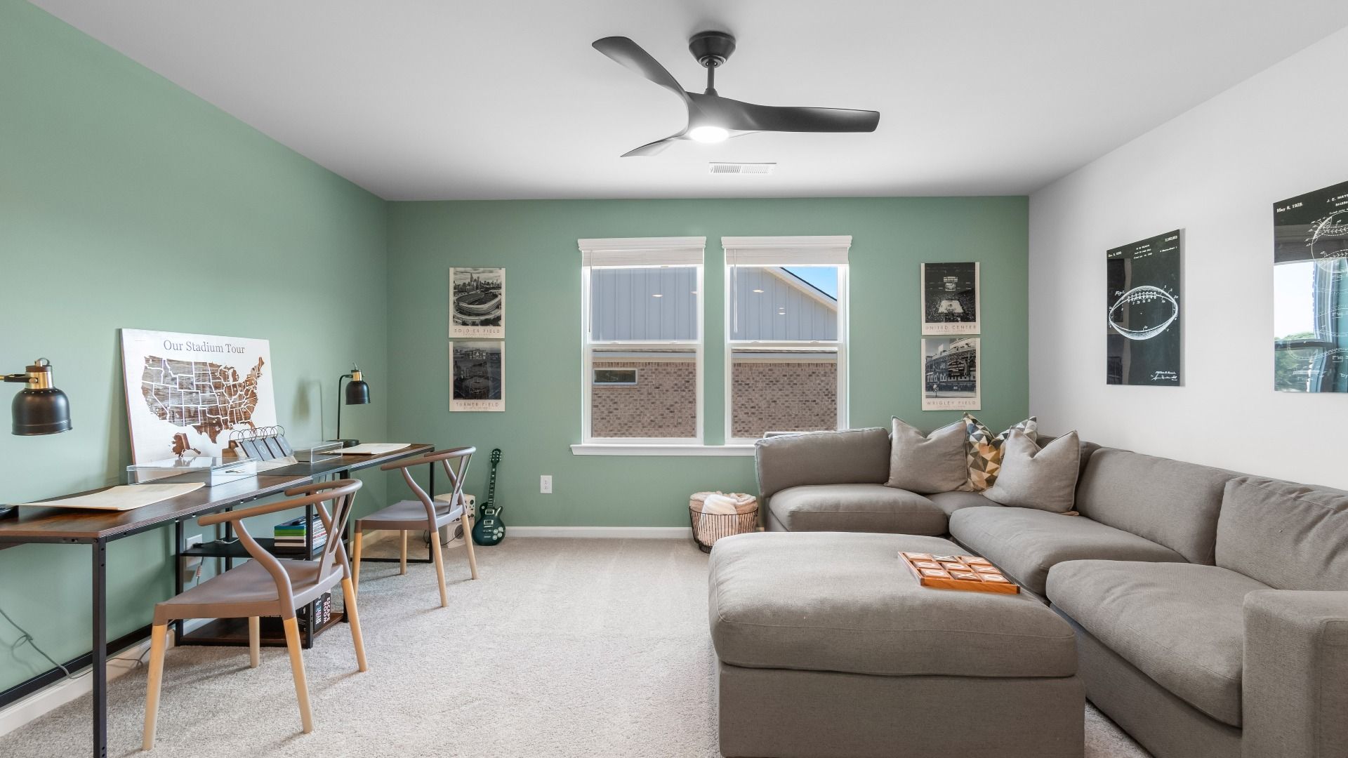 Generously-sized loft area with abundant seating room and natural light in the Ridgewood at Abbotts Crossing.