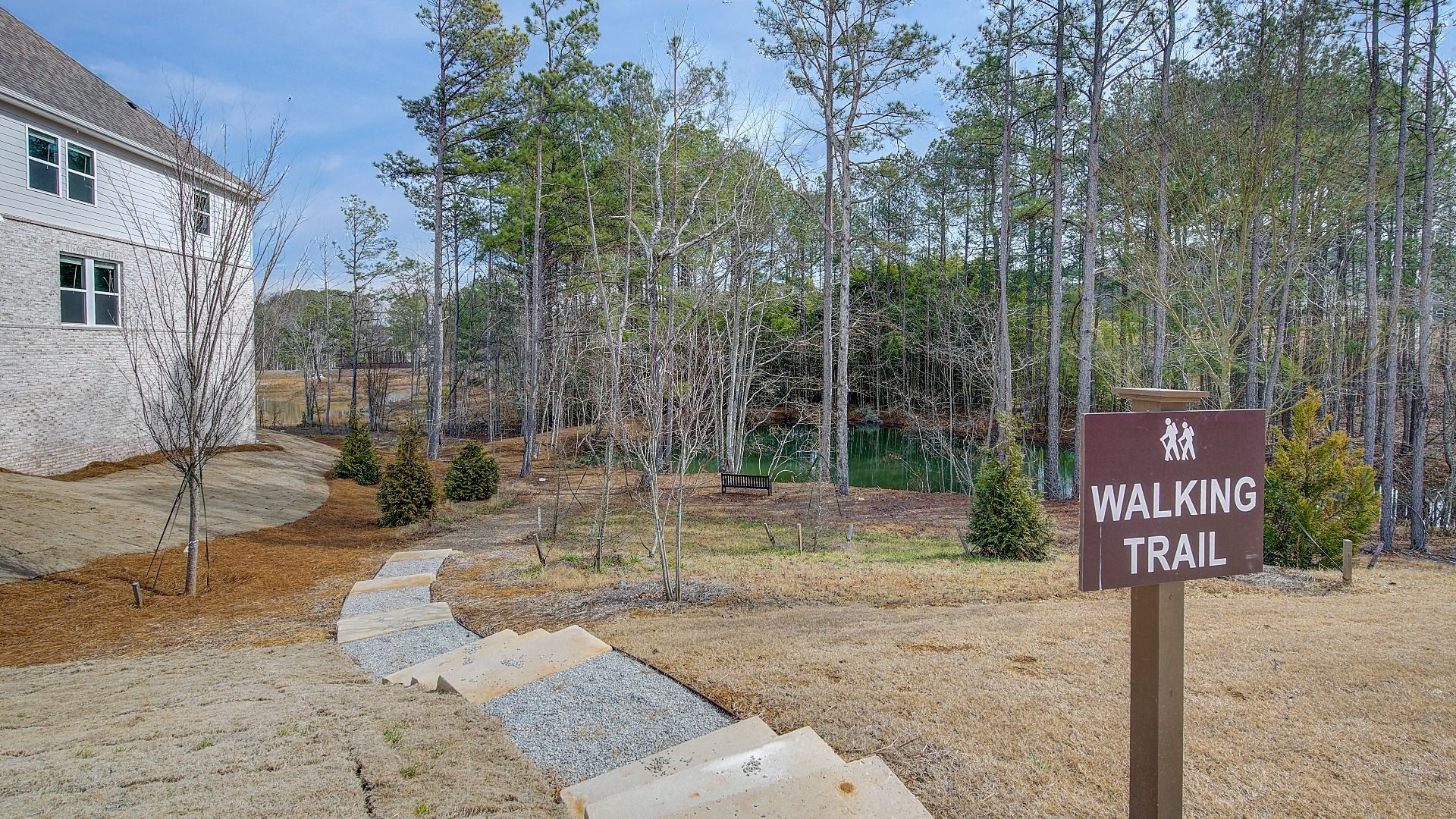 Scenic community walking trail in Hamilton Lakes featuring green space and pathways in Lawrenceville, GA.