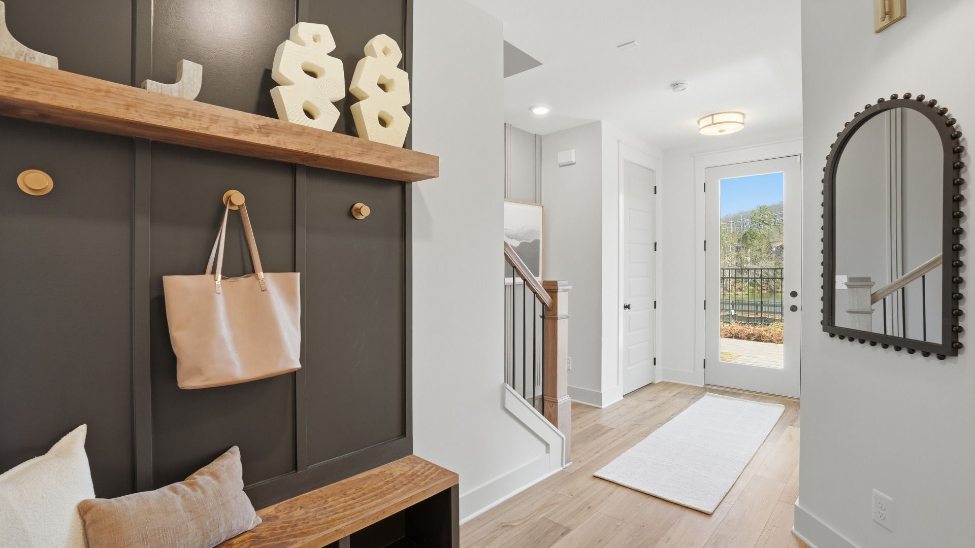 Seaton entry with LVP flooring and open foyer in new construction townhome at Barrett Pointe in Kennesaw, GA.