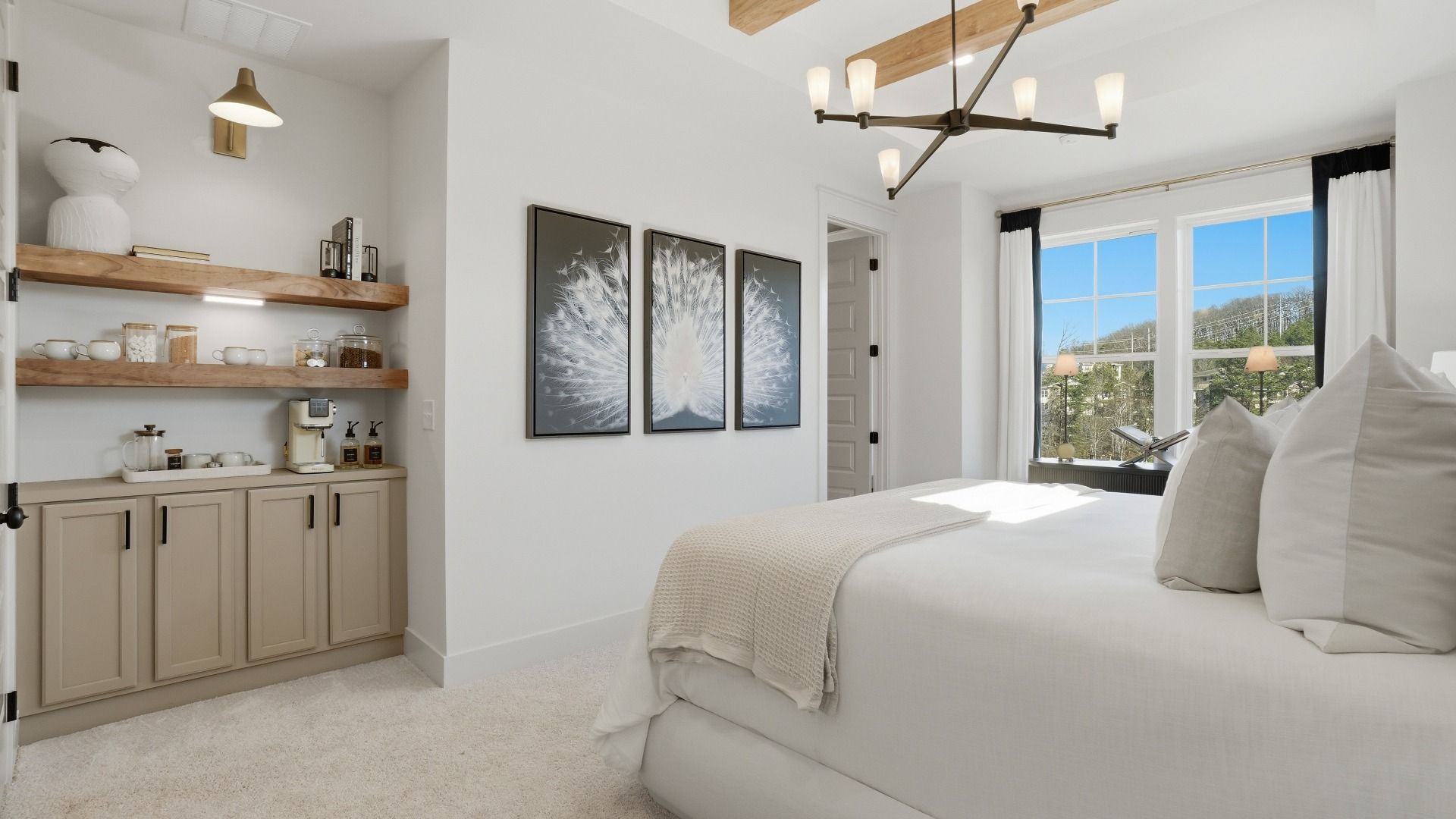 Spacious primary suite with carpet flooring, large windows, and neutral modern finishes in the Seaton at Barrett Pointe.