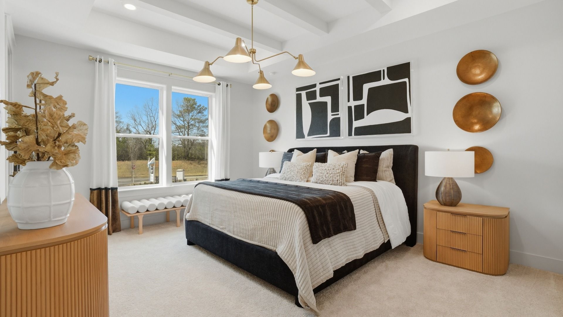 Elegant primary suite with decorative beamed ceiling and large windows for natural light in Barrett Pointe in Kennesaw, GA.